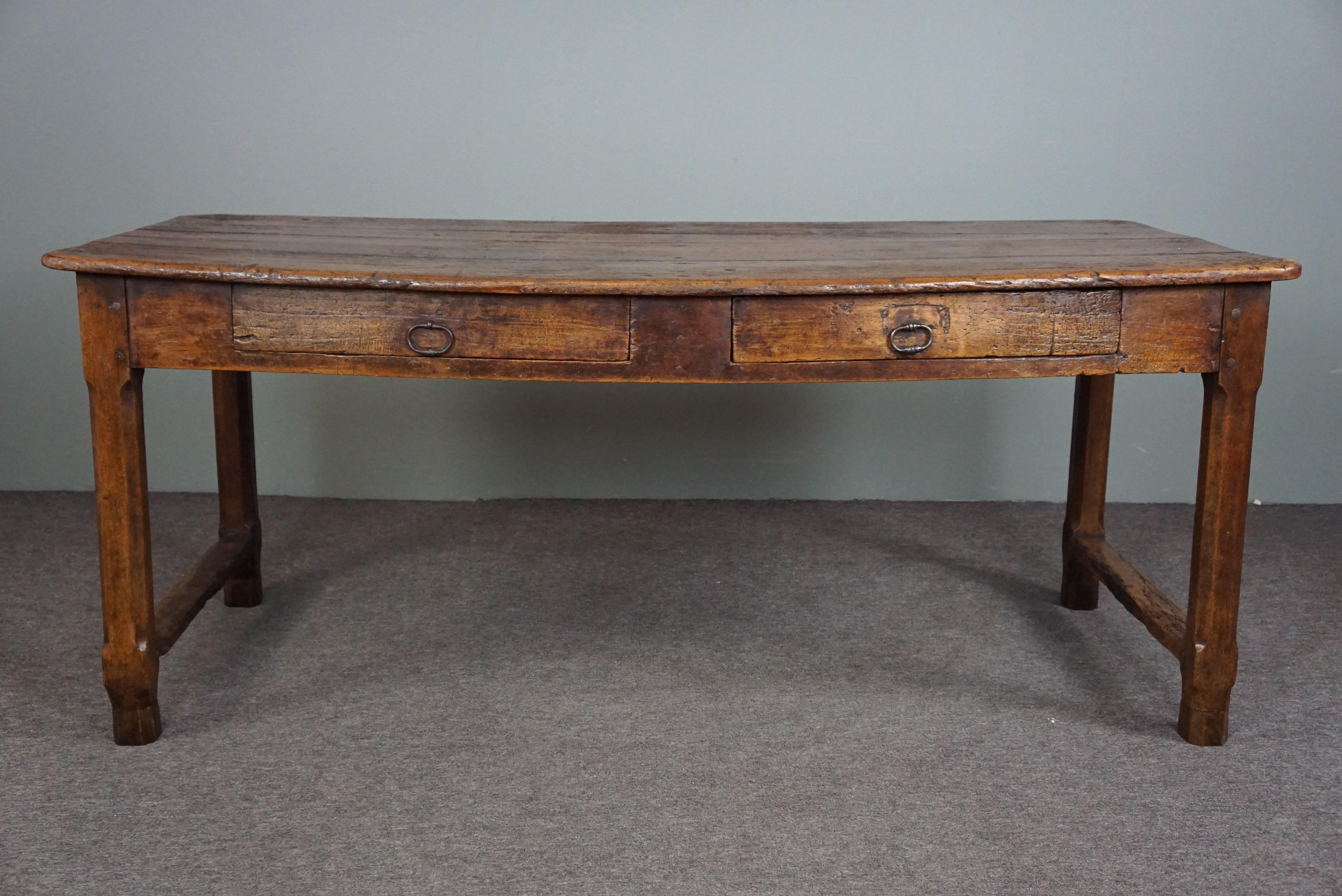 Offered is this very decorative antique dining table with a very expressive lived-in top, packed with details and therefore an asset for the true enthusiast!

This very beautiful French antique dining table comes from the end of the 18th century and