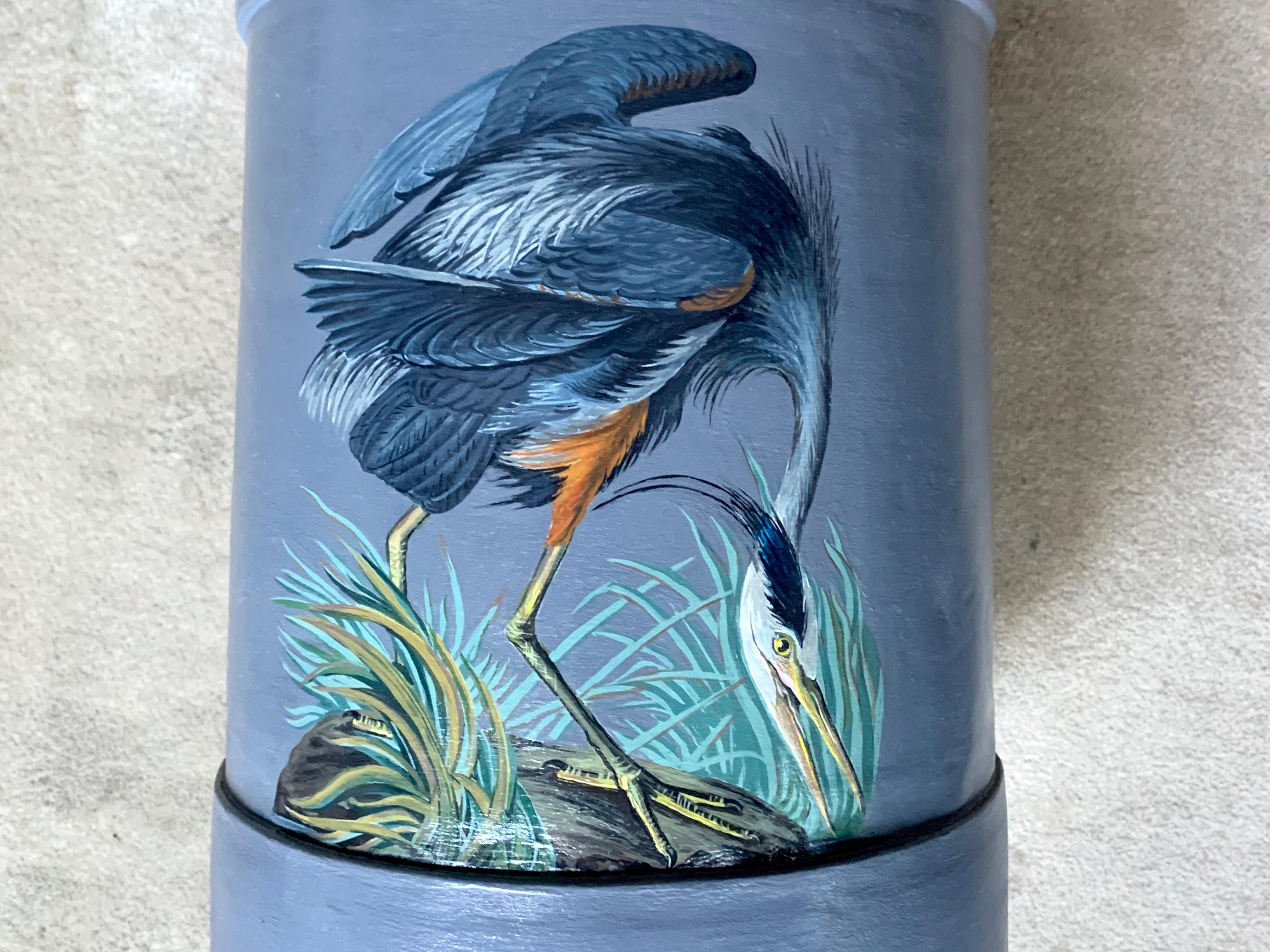 Great blue heron umbrella stand. Vintage American farm house milk can painted in blue grey with Audubon great blue heron. United States, early 20th century.
Dimensions: 9.5