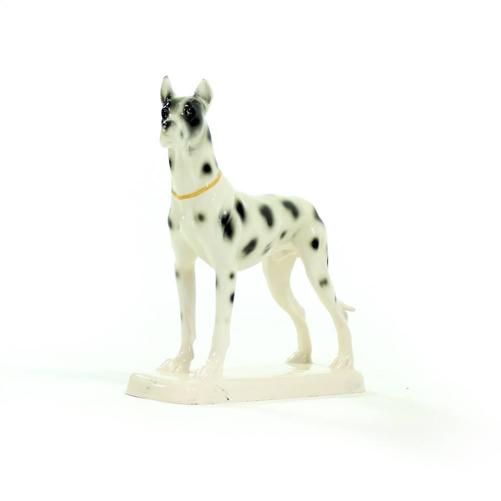 Elegant and impressive sculpture of Great Dane dog. The sculpture is produced and marked on the bottom by the German Hertwig & Co. Katzhütte. It is made of porcelain with glazed finish and hand-painted details. The label Hertwig 22 was used in years
