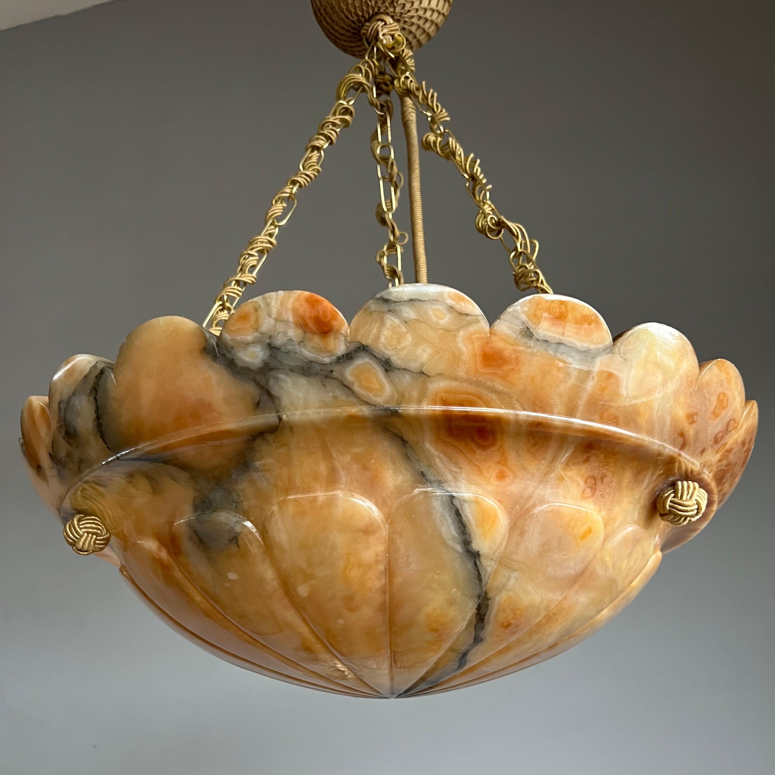 Stunning and large size antique ceiling fixture.

With early 20th century lighting as one of our specialities, we were again thrilled to find a unique Art Deco pendant made of the most striking alabaster imaginable. We have sold antique alabaster