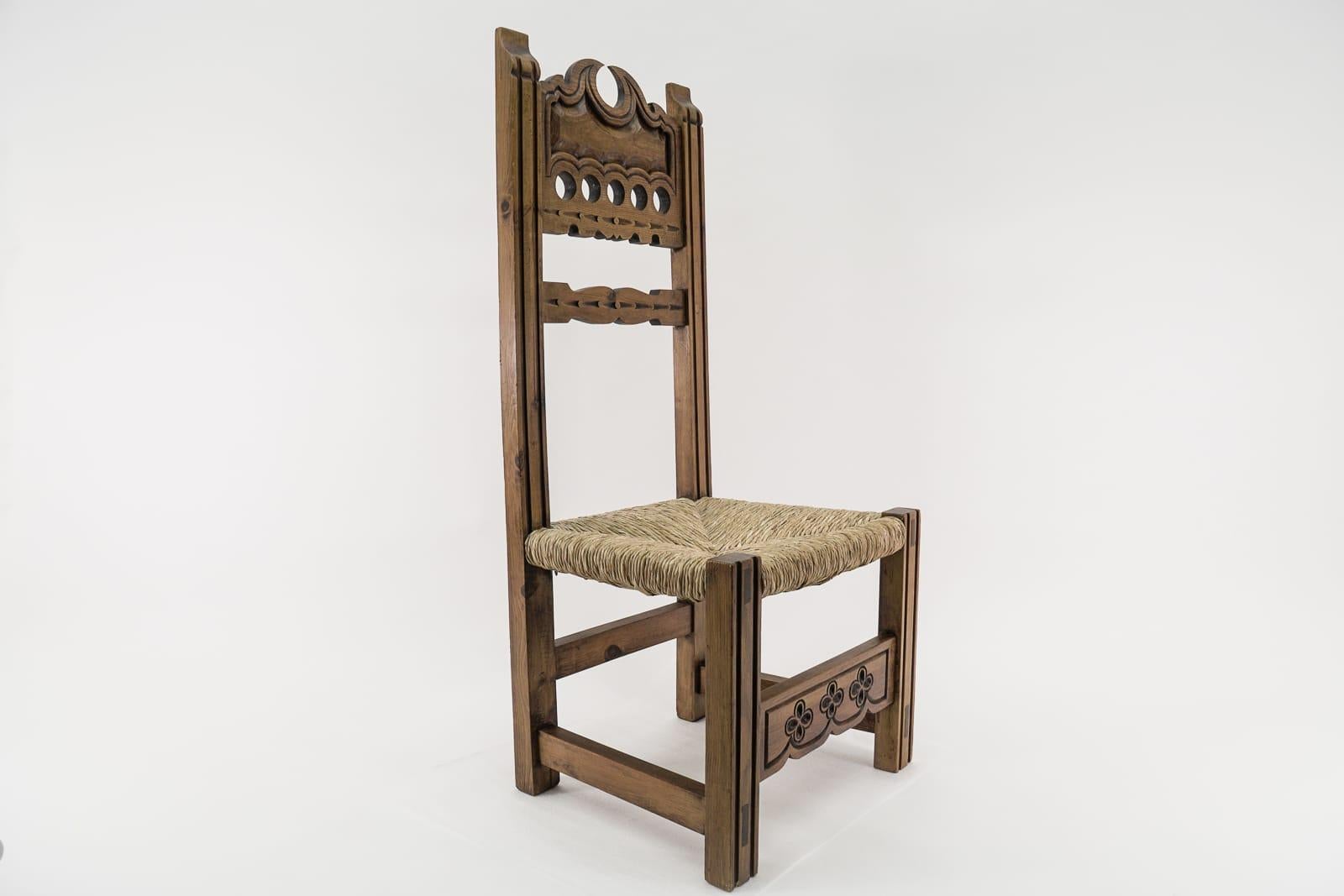 Great hand carved wooden high back chair with sea grass seat from Spain, 1960s.

The pictures speak for themselves.