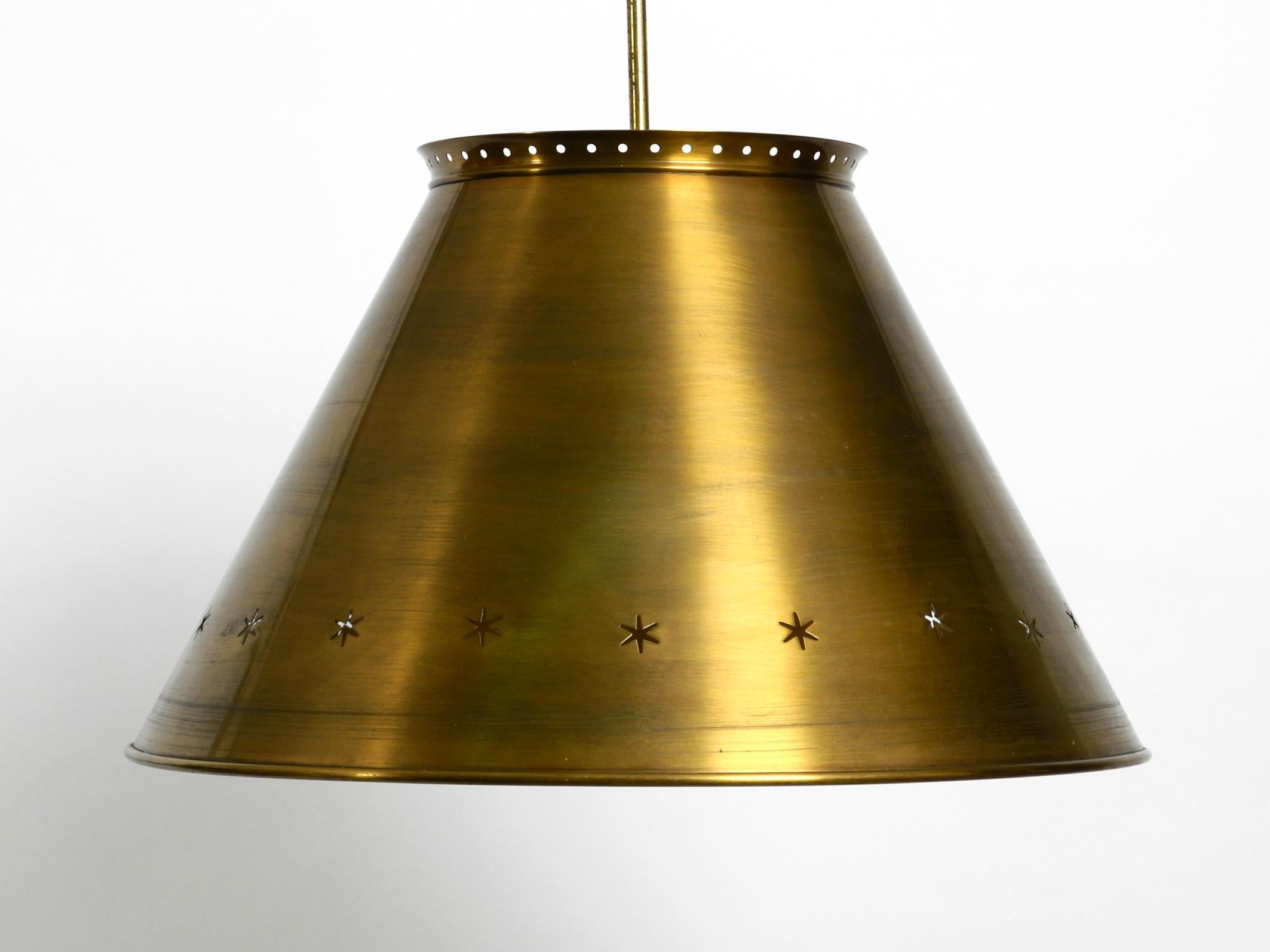 Great Italian XXL mid century brass ceiling lamp.
Beautiful minimalist design with lots of details. Completely made of brass.
Long rod and canopy also made of brass.
Creates very nice pleasant warm light.
Very good vintage condition with no