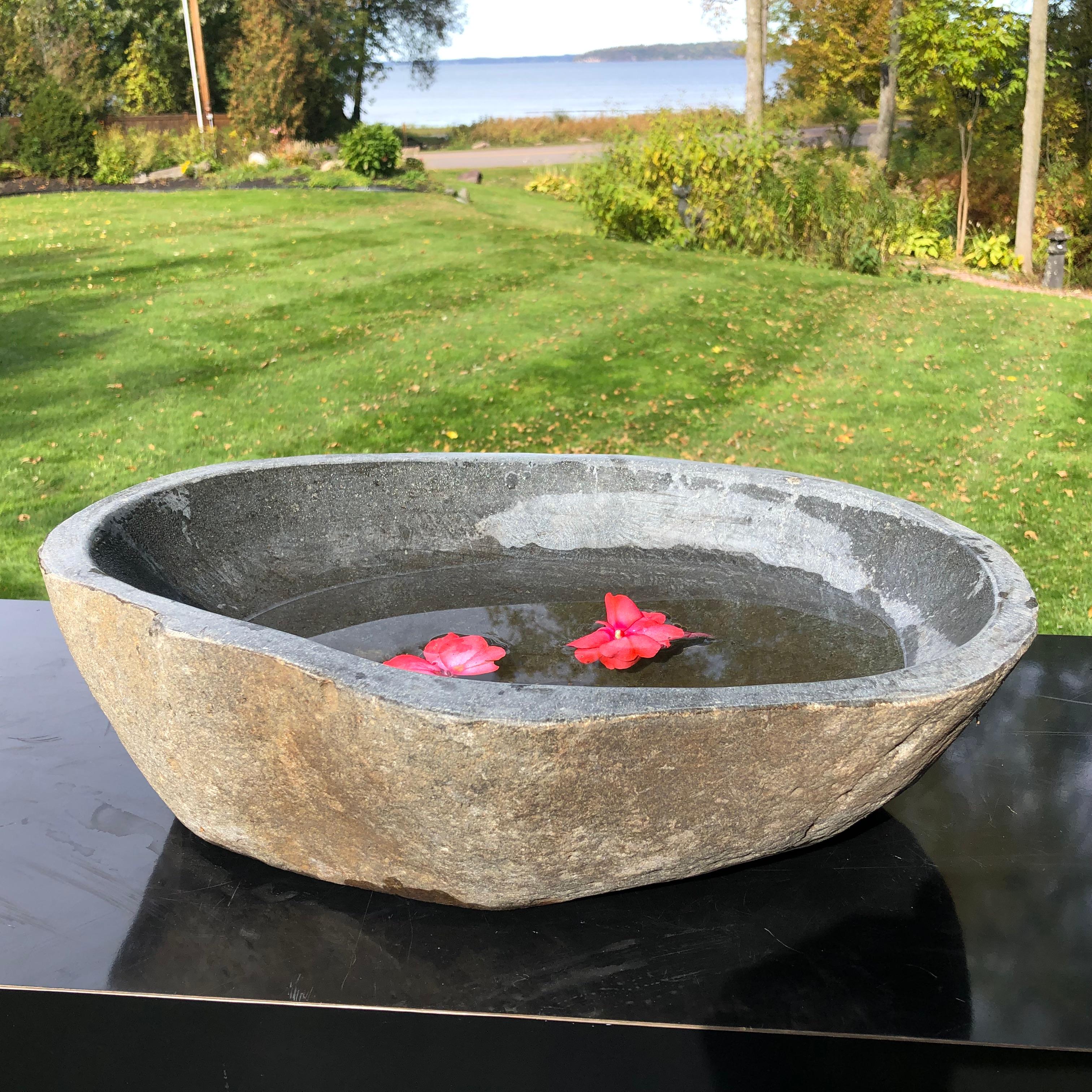 A one-of-a-kind visually attractive hand carved solid stone 
garden planter or water basin hand carved from a natural river boulder.

In an organic natural form.

Beautiful simple design. Inside smooth to the touch.

Totally natural color