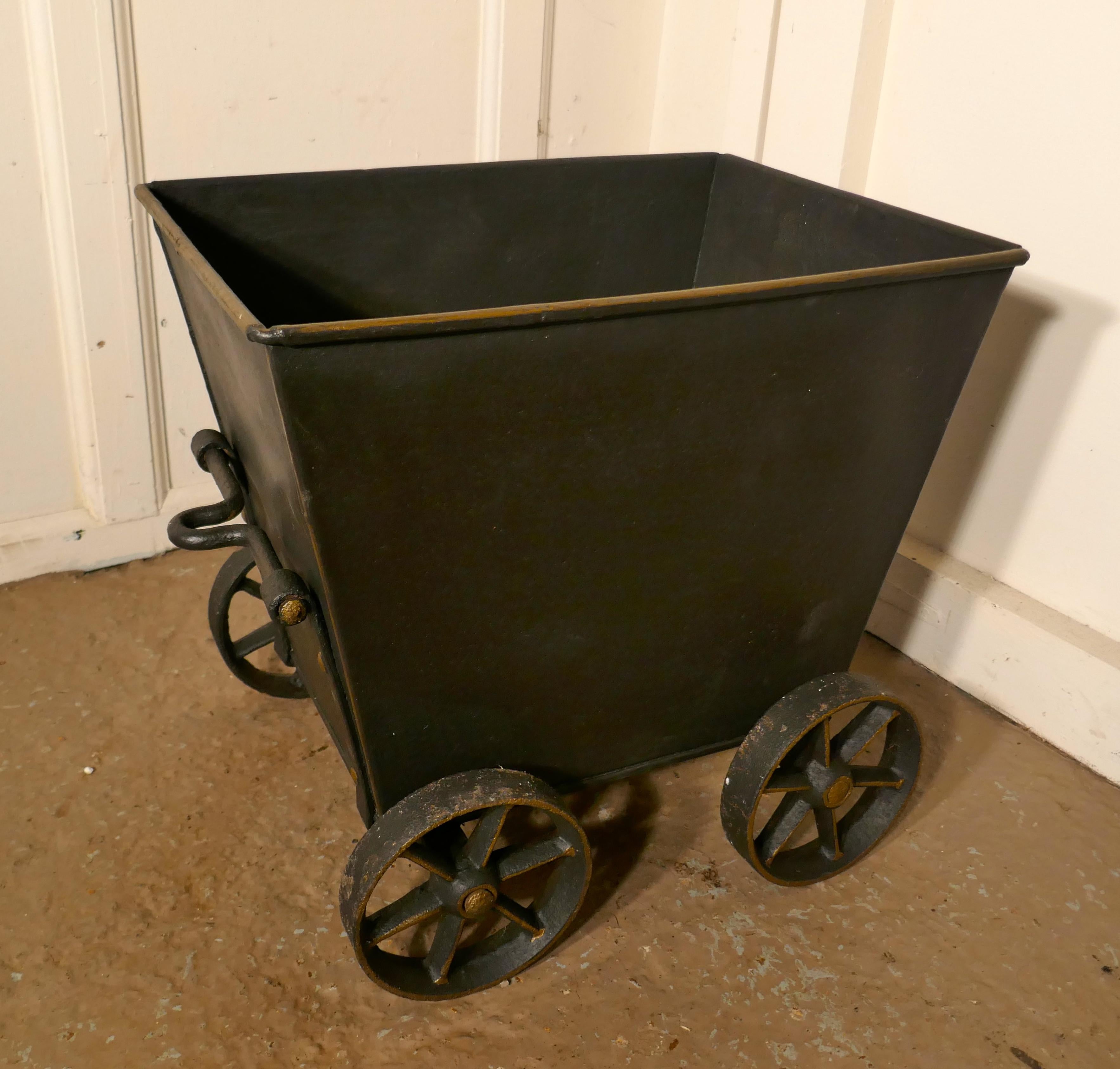 Great Little Blacksmith Made Coal Wagon, Coal Scuttle

A 20th Century Replica of a steam drawn coal Wagon, this is hand made piece, it is made in Heavy iron, it has hand forged wheels and towing mechanism, the top edge of the box as faded Gold rim
