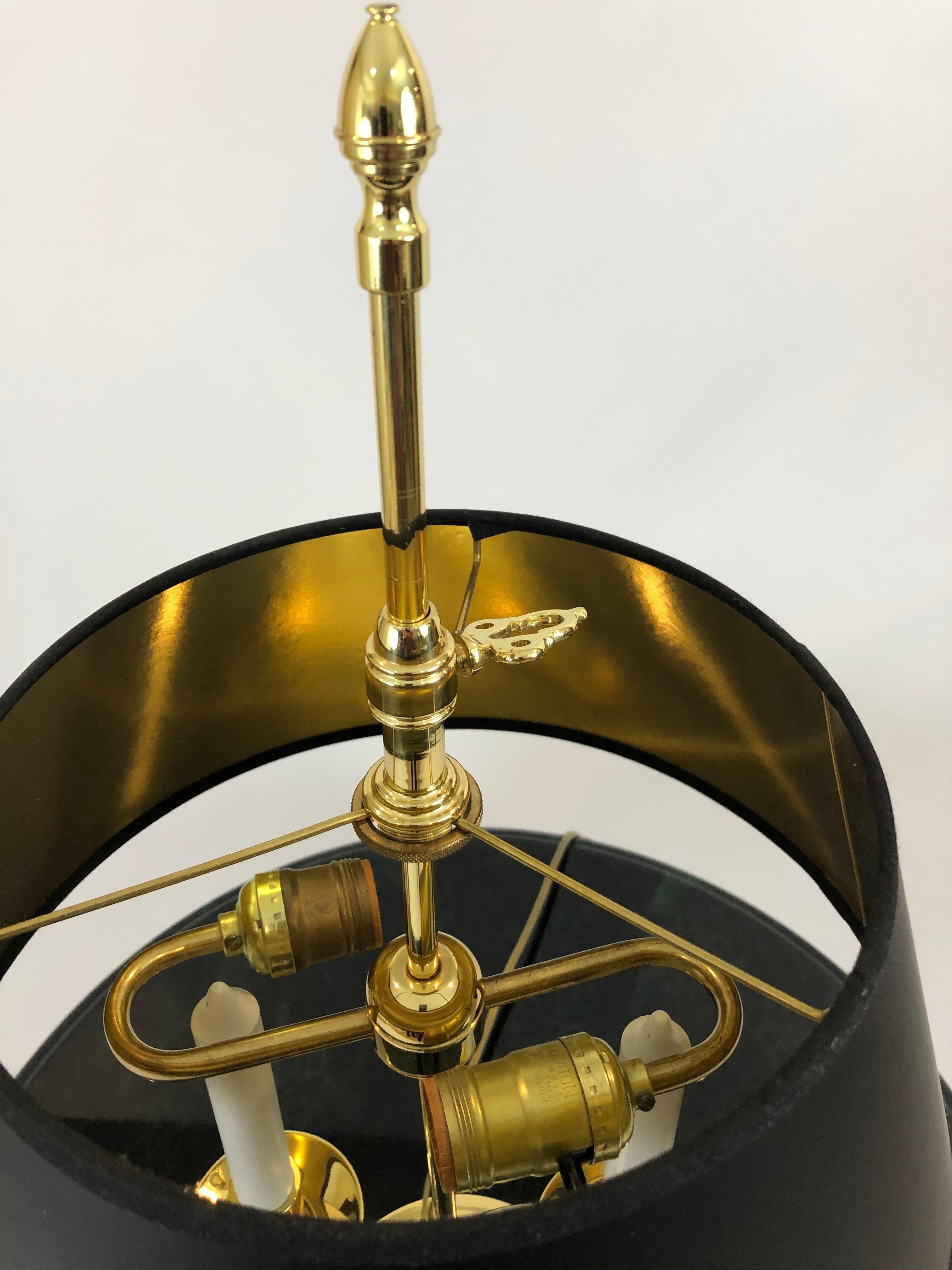 Great looking brass accent lamp by Baldwin having prezel like curlicues terminating in brass cups supported by fabulous crane faces. Handsome custom black shade lined in gold foil, brass key and decorative finial.
Base is 8.5 W x 23 H.