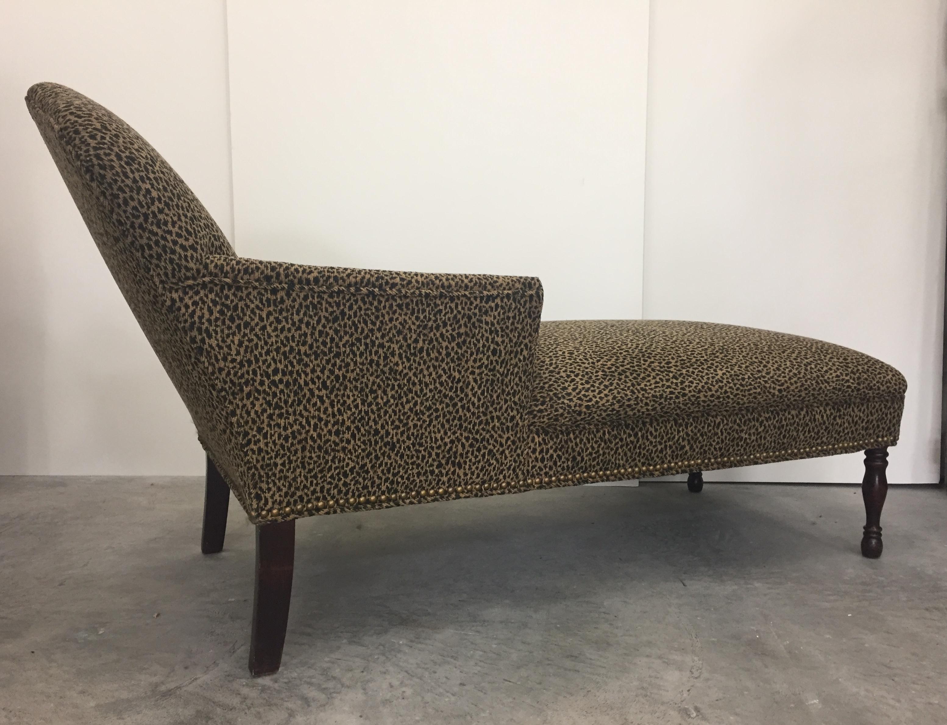 Stylish vintage chaise with an elegant silhouette having mahogany legs and new faux leopard cotton upholstery.
Seat height 18
Arm height 20.5.