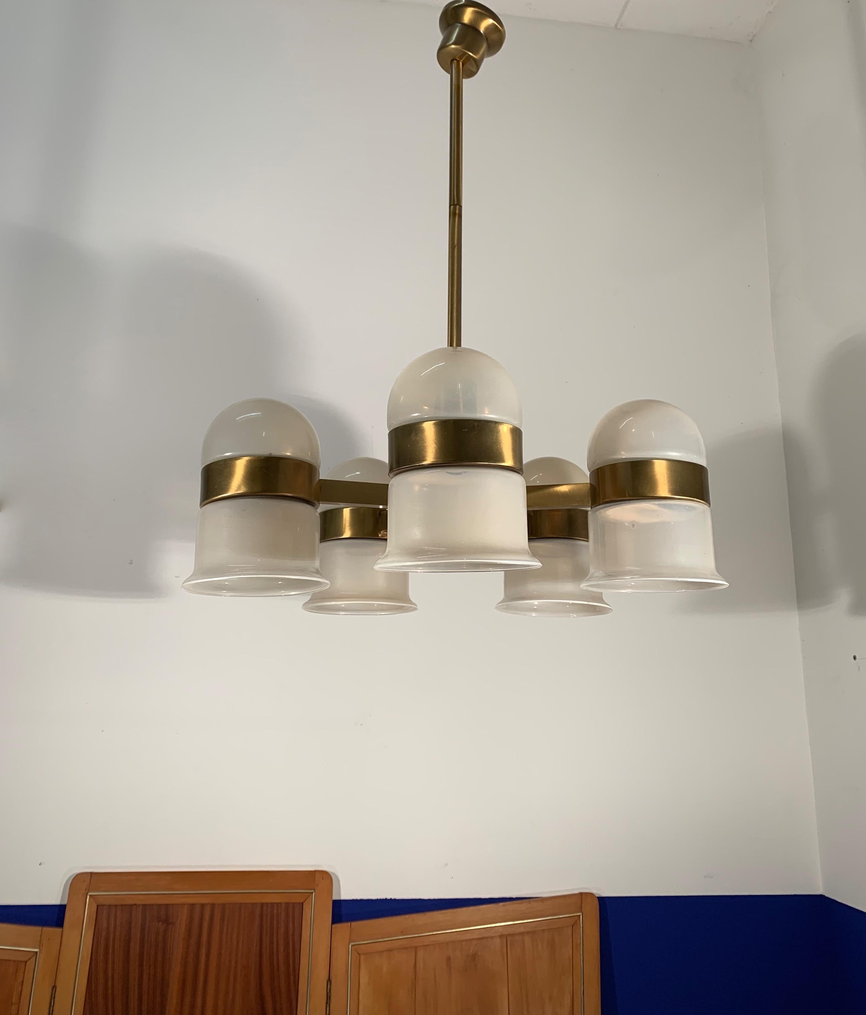 Rare, wonderful and great design chandelier.

With 20th century lighting as one of our specialities, we could not have been more happy to find this chandelier. We may not know who designed it, but we recognize a unique and striking light when we see