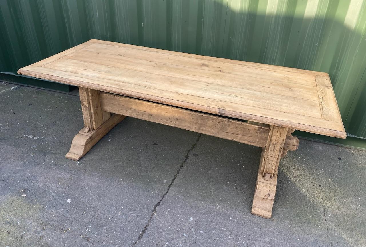 A great looking table with a slightly rustic feel, made from solid Oak in France in the early 1900s. Of excellent quality construction this table will be around for generations to come. We have lightly bleached it for a lighter look and to bring out