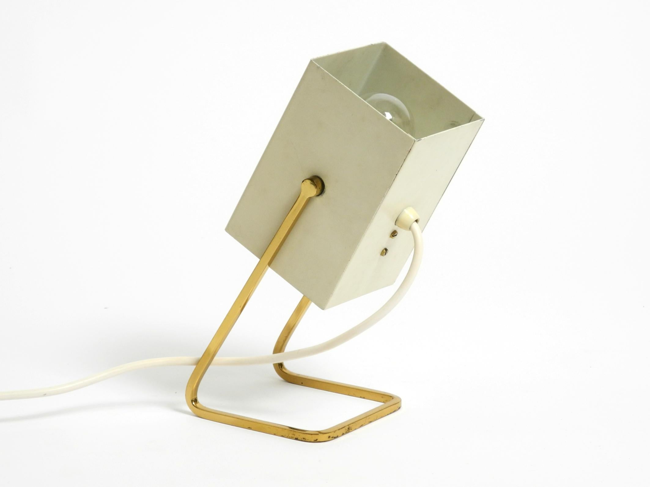 German Great Mid Century Modern metal bedside lamp with brass base by Kaiser Leuchten For Sale