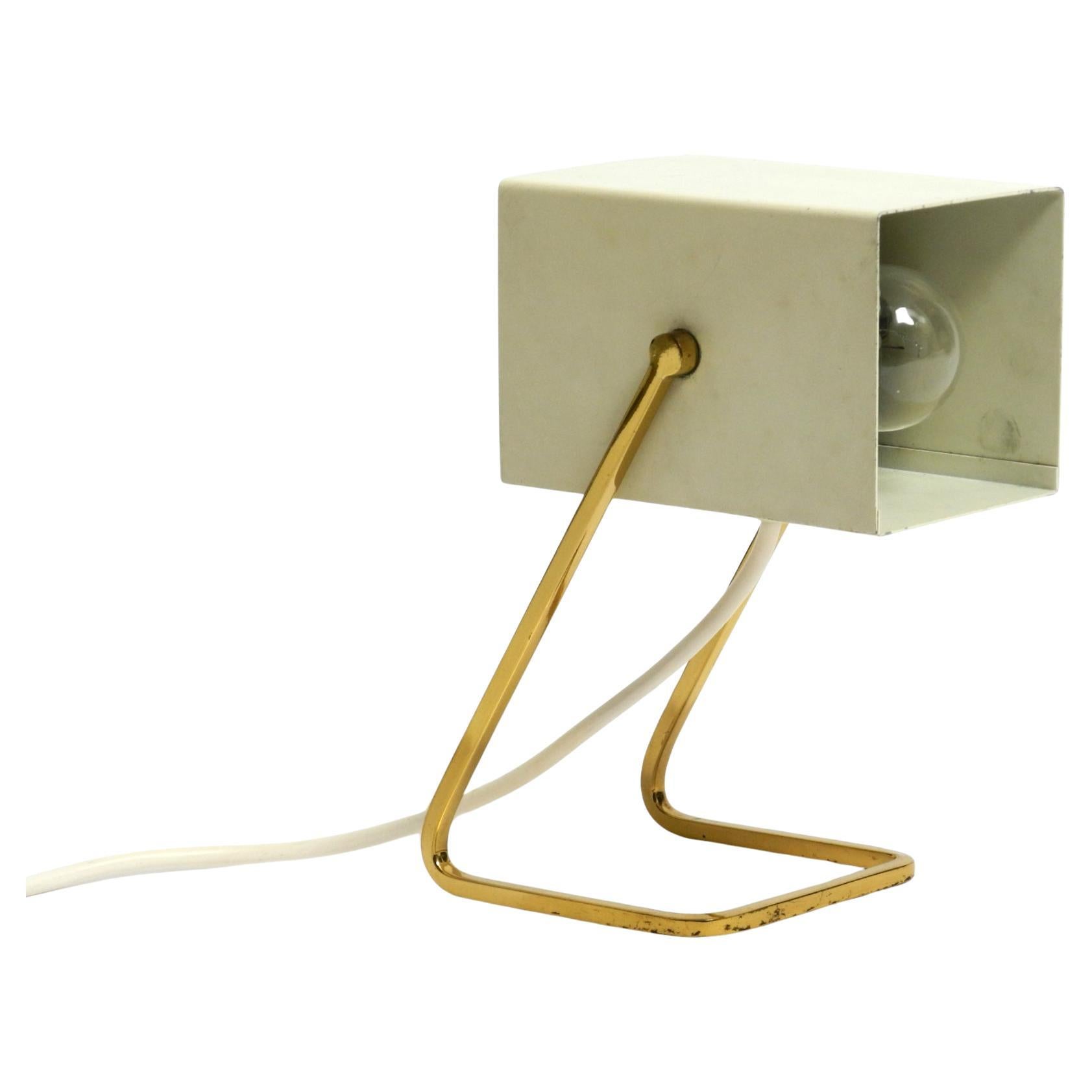Great Mid Century Modern metal bedside lamp with brass base by Kaiser Leuchten For Sale