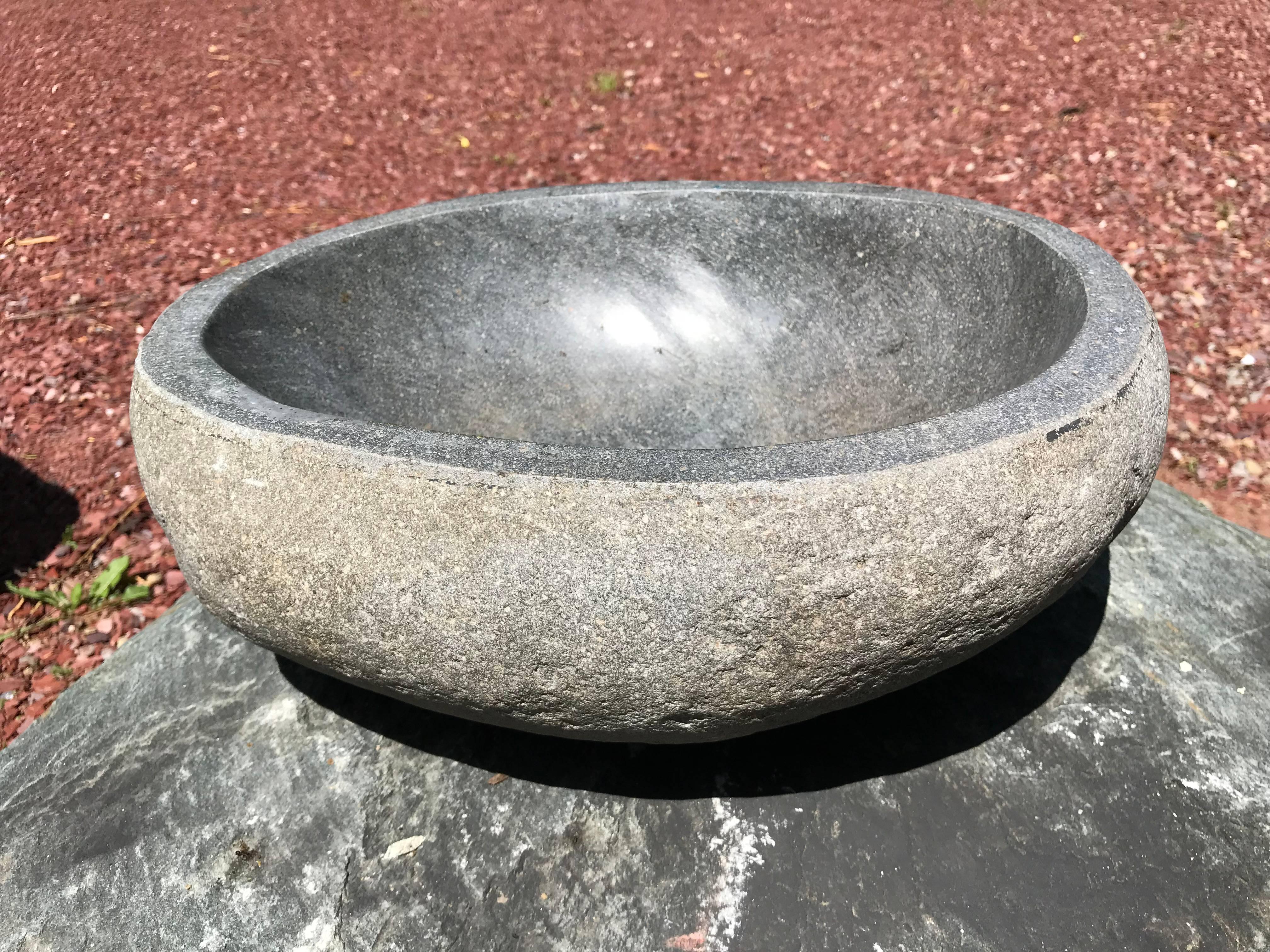 A one-of-a-kind visually attractive hand carved solid stone 
garden planter or water basin hand-carved from a natural river boulder.

In an organic natural form.

Beautiful simple design. Inside smooth to the touch.

Totally natural color