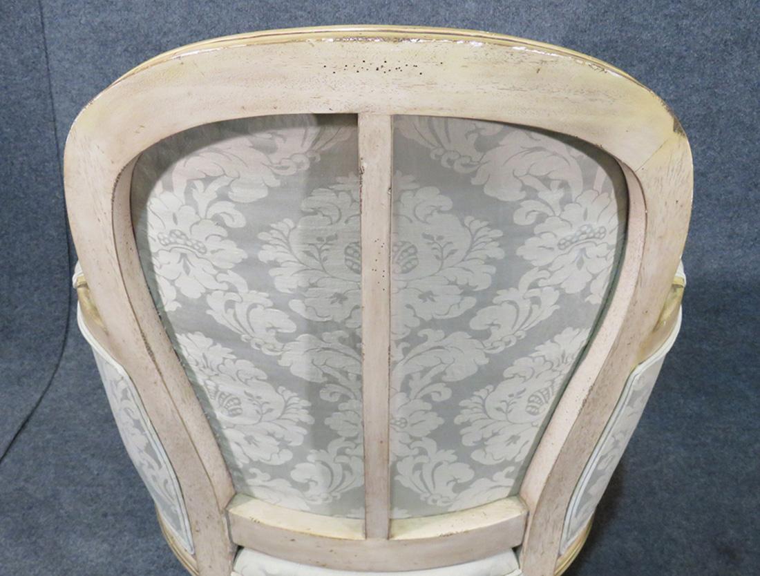 These chairs are in a gorgeous greenish blue silk damask fabric with distressed painted frames. 

Measures: 37.5 tall x 26.75 wide x 30.5 deep seat height is 20.