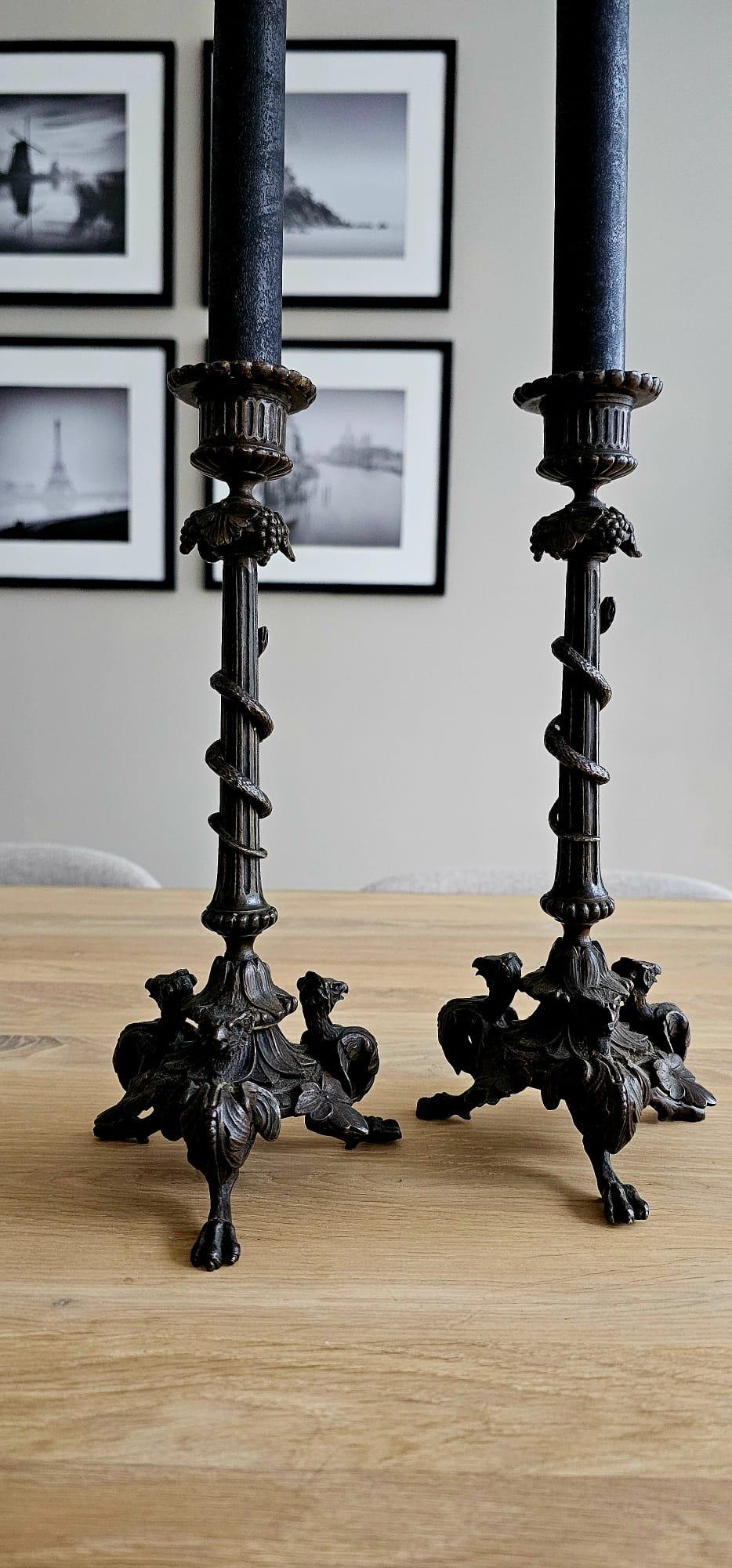 Practical size, antique fine bronze candleholders with original and removable bobeches.

If you are looking for excellent condition antiques to create the perfect atmosphere then this attractive and decorative pair of bronze candlesticks could be