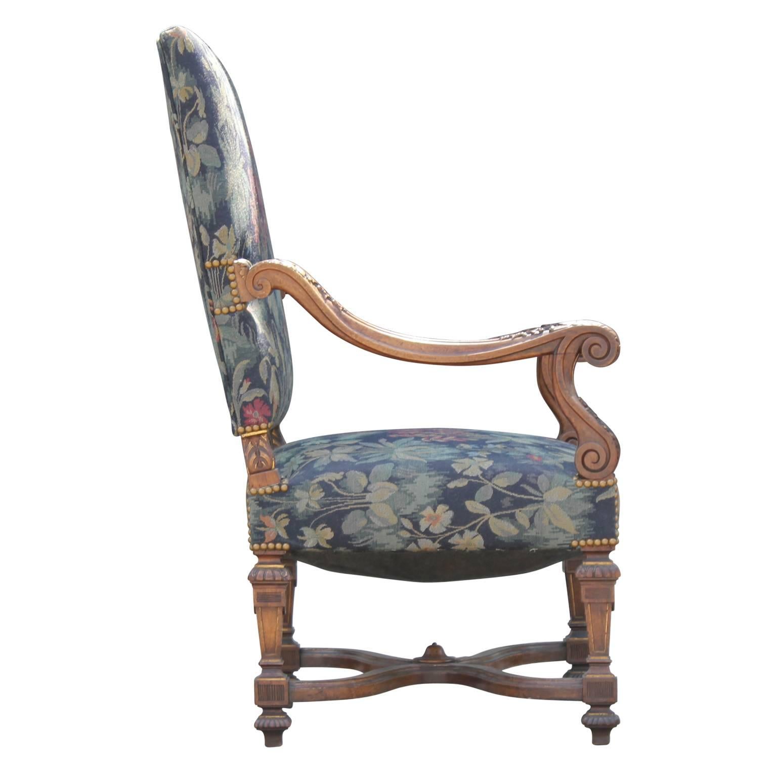 Great Pair of early French Louis XVI highly-carved walnut armchairs. The chair frames are in excellent shape. The fabric is decent but new upholstery is recommended. 
These are very high quality chairs and will not disappoint.
