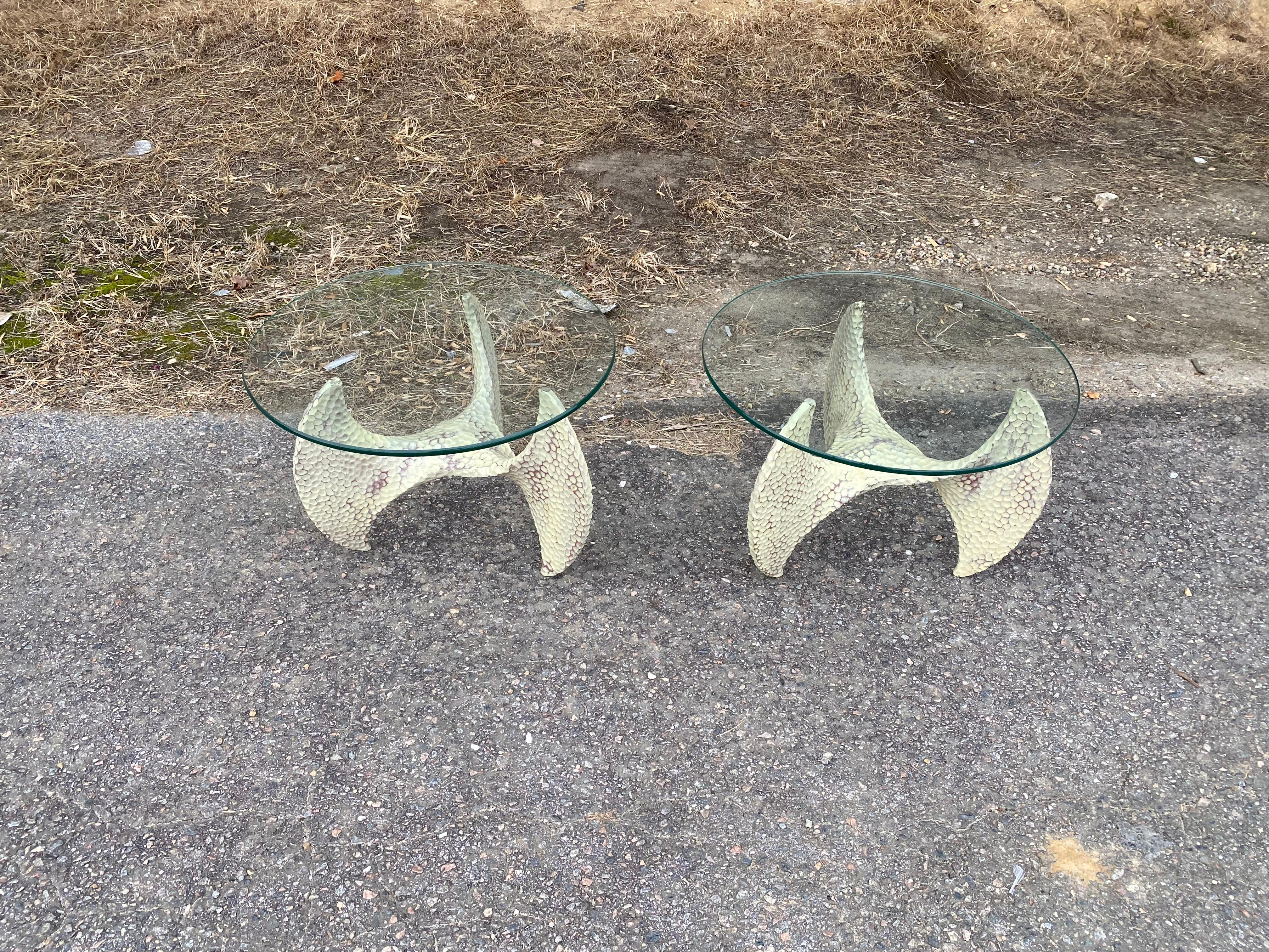 Great pair of vintage propellor form side tables. Dimpled and painted aluminum bases with glass tops.