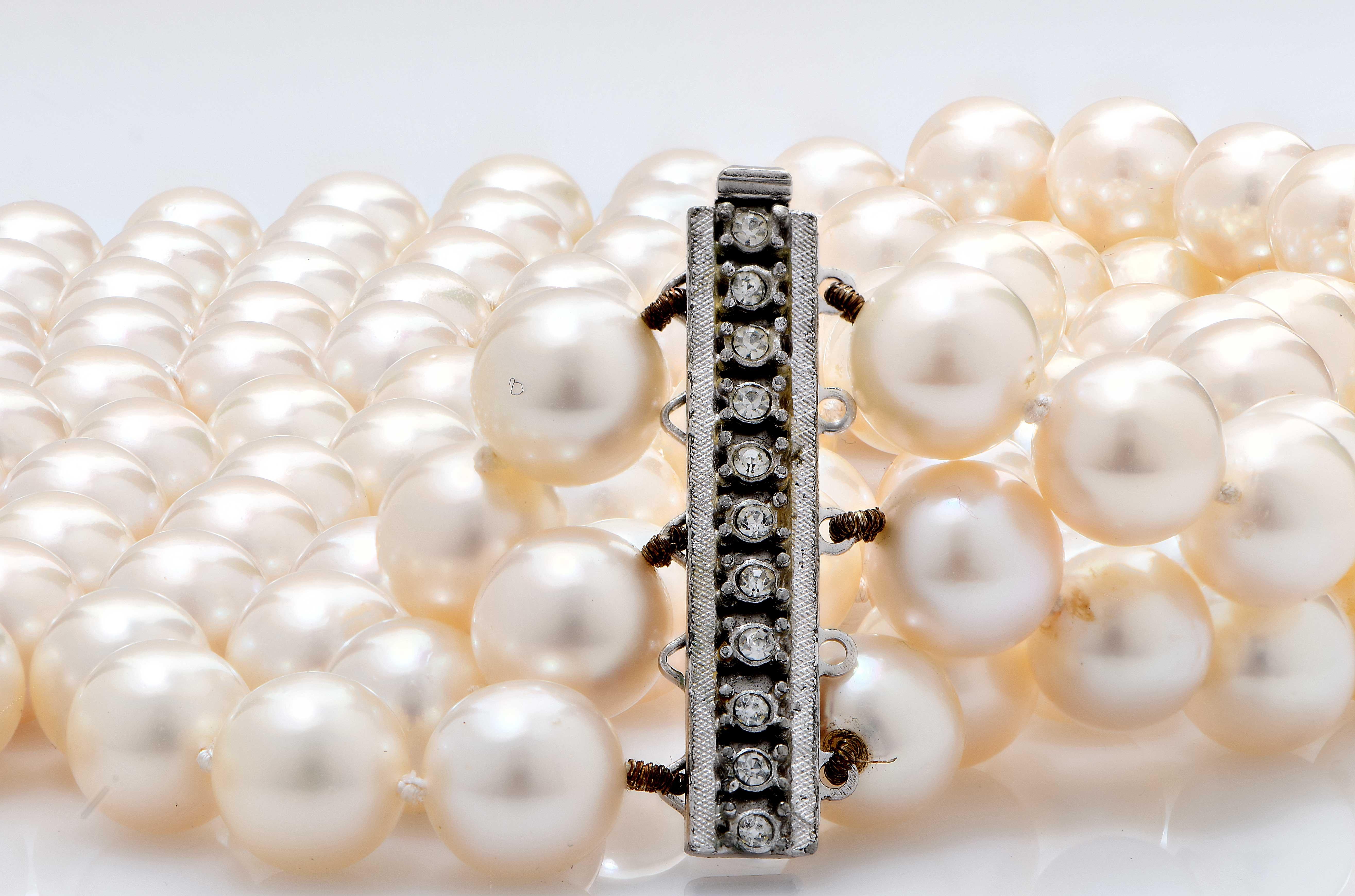 Beautiful Akoya Culured Pearl Necklace featuring three rows of 9mm pearls with each row measuring 19,20 and 22 inches accordingly. With a vintage clasp with diamonds. These pearls are from the 1970's and have very thick nacre which gives them a