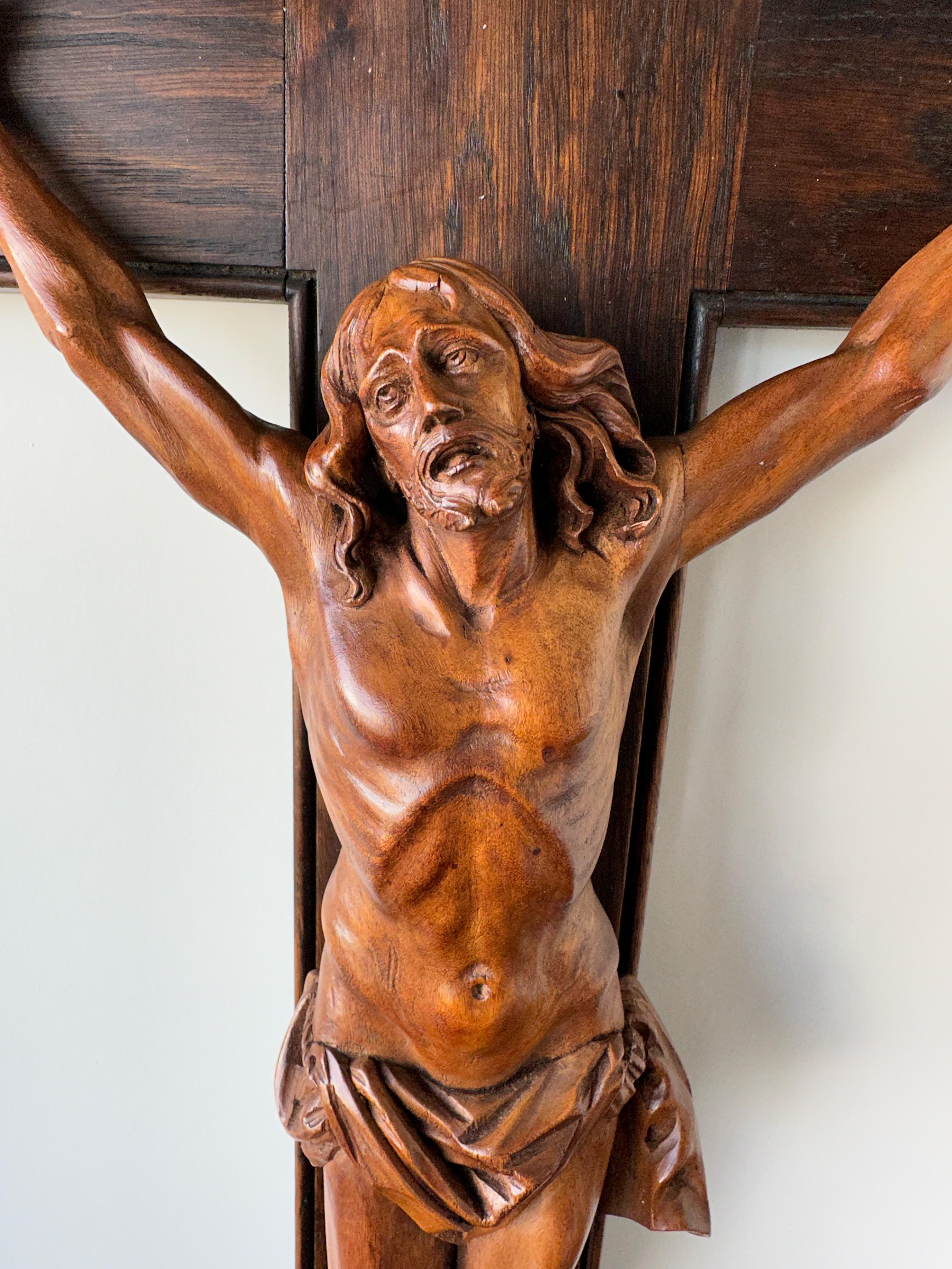 Antique crucifix with stunning hand carved details and an amazing patina.

This remarkable and good size crucifix with a sculpture of a suffering Christ on the cross is another one of our recent great finds. The artist who hand-carved this