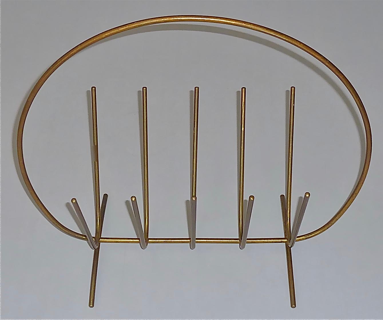 Rare modernist Austrian magazine rack or stand which probably belongs to one of the beautiful designs by Aubock, Hagenauer, Josef Frank for Haus & Garten or Kalmar, Austria 1950s. The elegant minimalist and reduced to simplicity magazine rack is