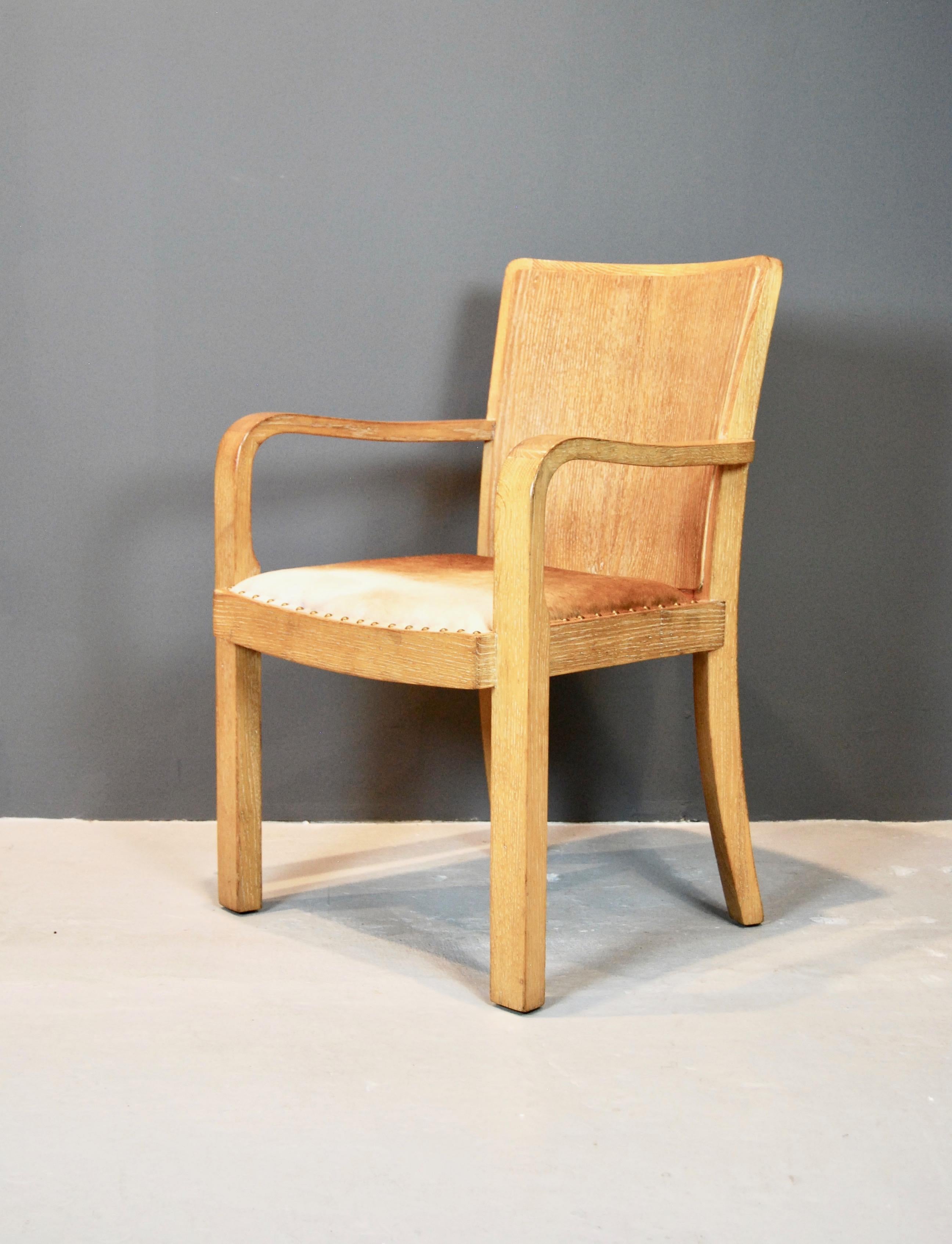 Great scale armchair, perfect for a desk, made of straight cut oak, beautifully cerused. 
Two tone pony hide beautifully complements the wood.
 Jean-Michel Frank elements throughout.