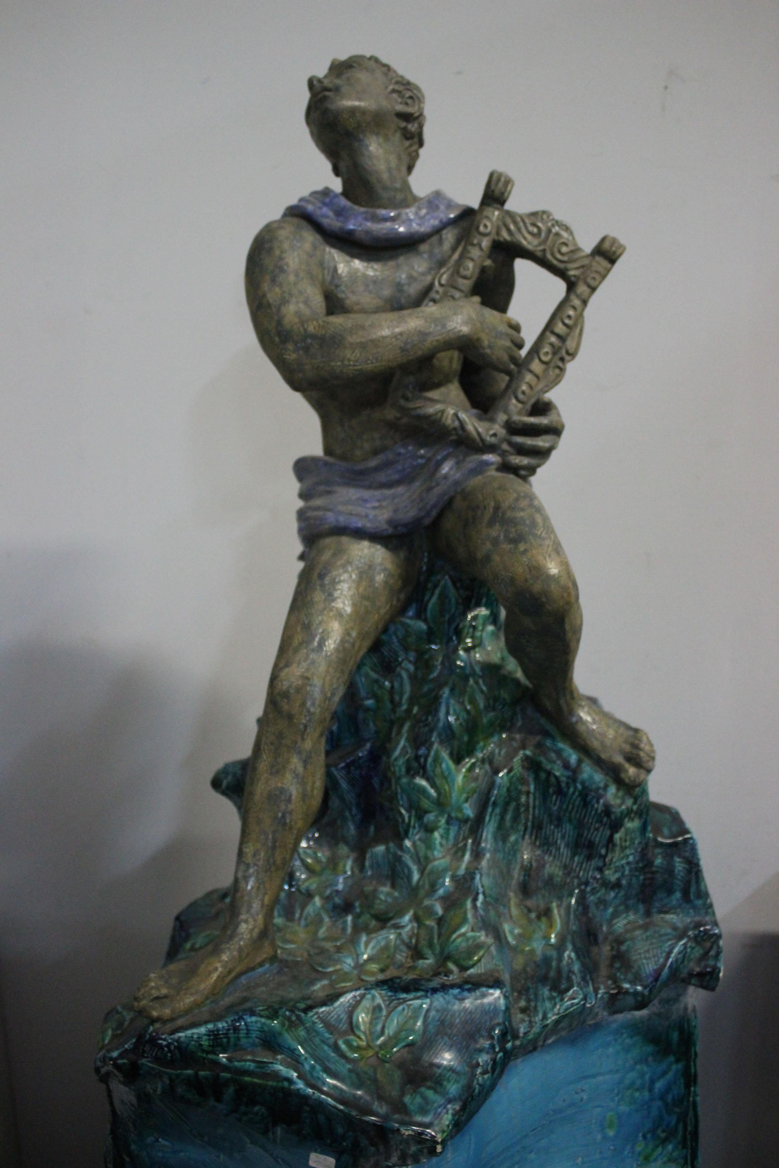 Polychrome sculpture of Orpheus playing the lyre (or cithara), the execution of the work is certainly an atypical workmanship and great skill, the body well made and harmonious, the hands and feet masterfully executed are finished with scratches and