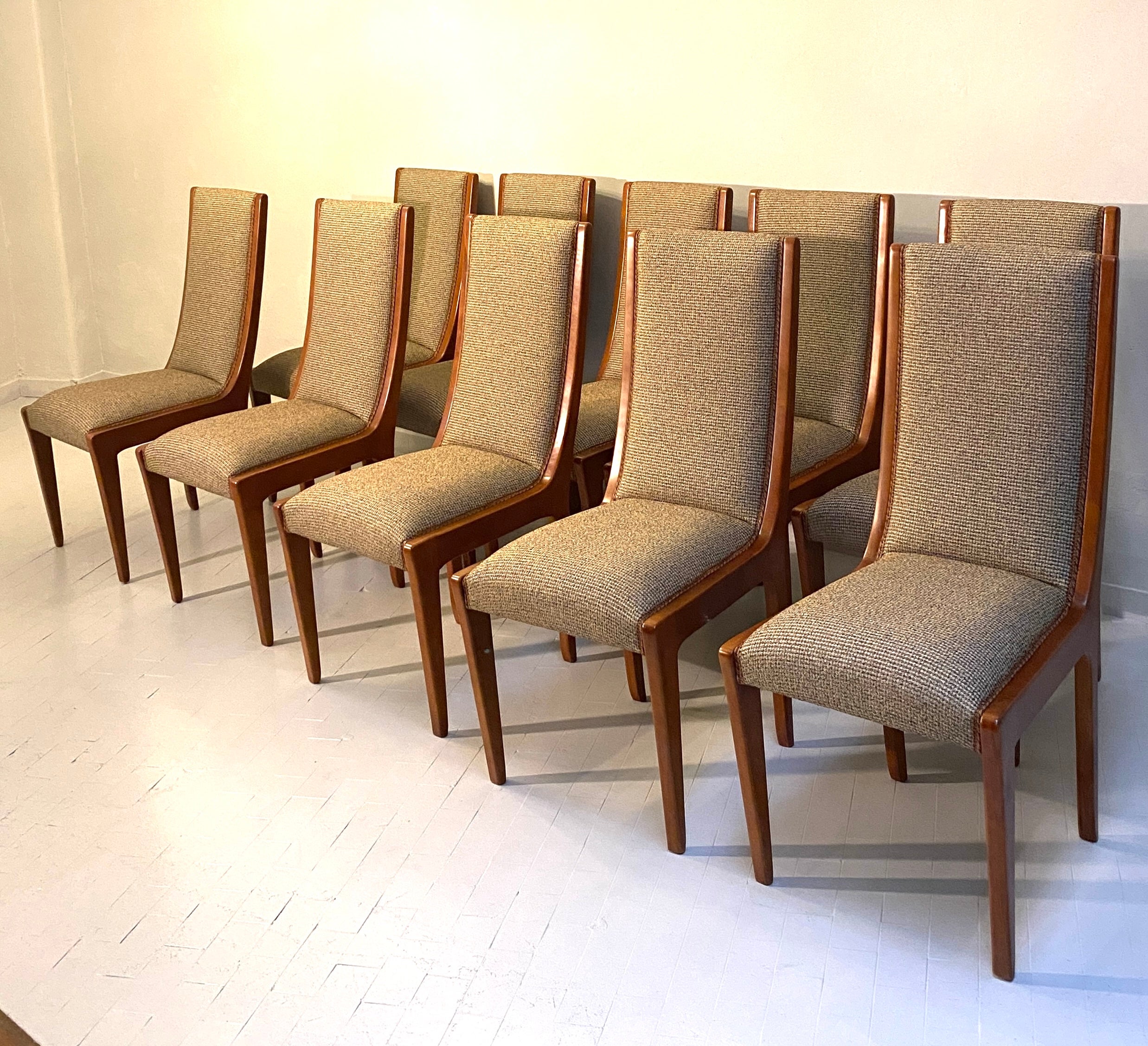  
Very fine set of Italian Art deco style 10 chairs and 2 Armchairs.  These chairs are the exact reproduction of the original set designed by a famous Italian designer of the 30'.  The last images shows the original item. 
 We can customize the