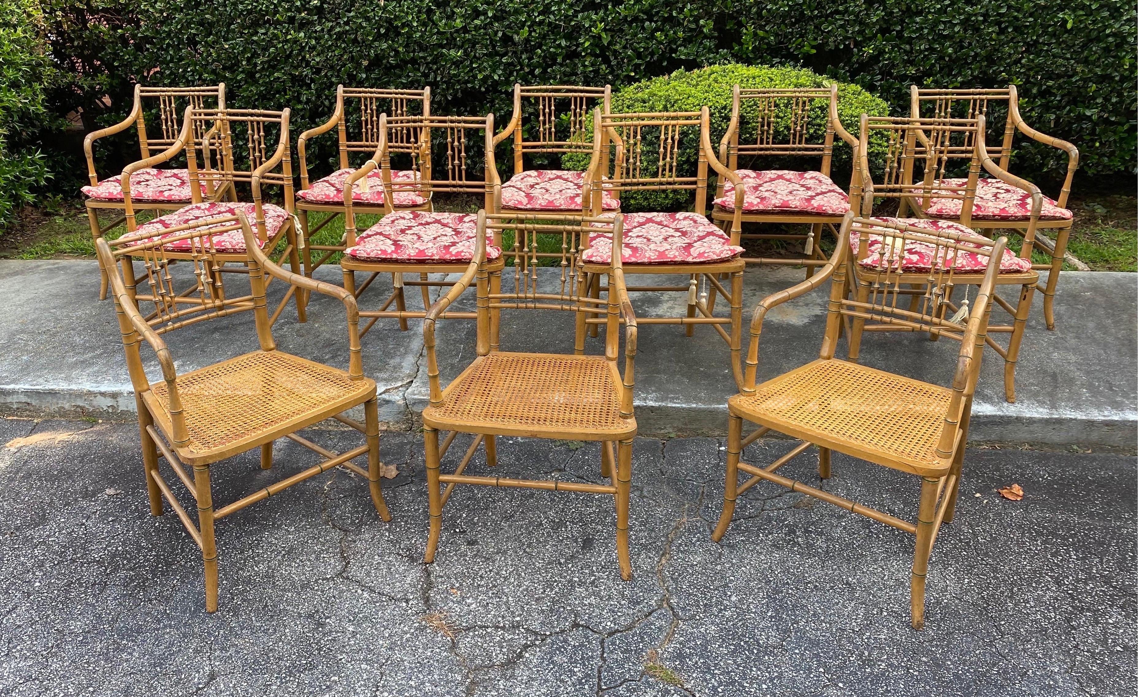 Great set of 12 paint decorated 19th century faux bamboo armchairs with cane seats and custom made cushions.