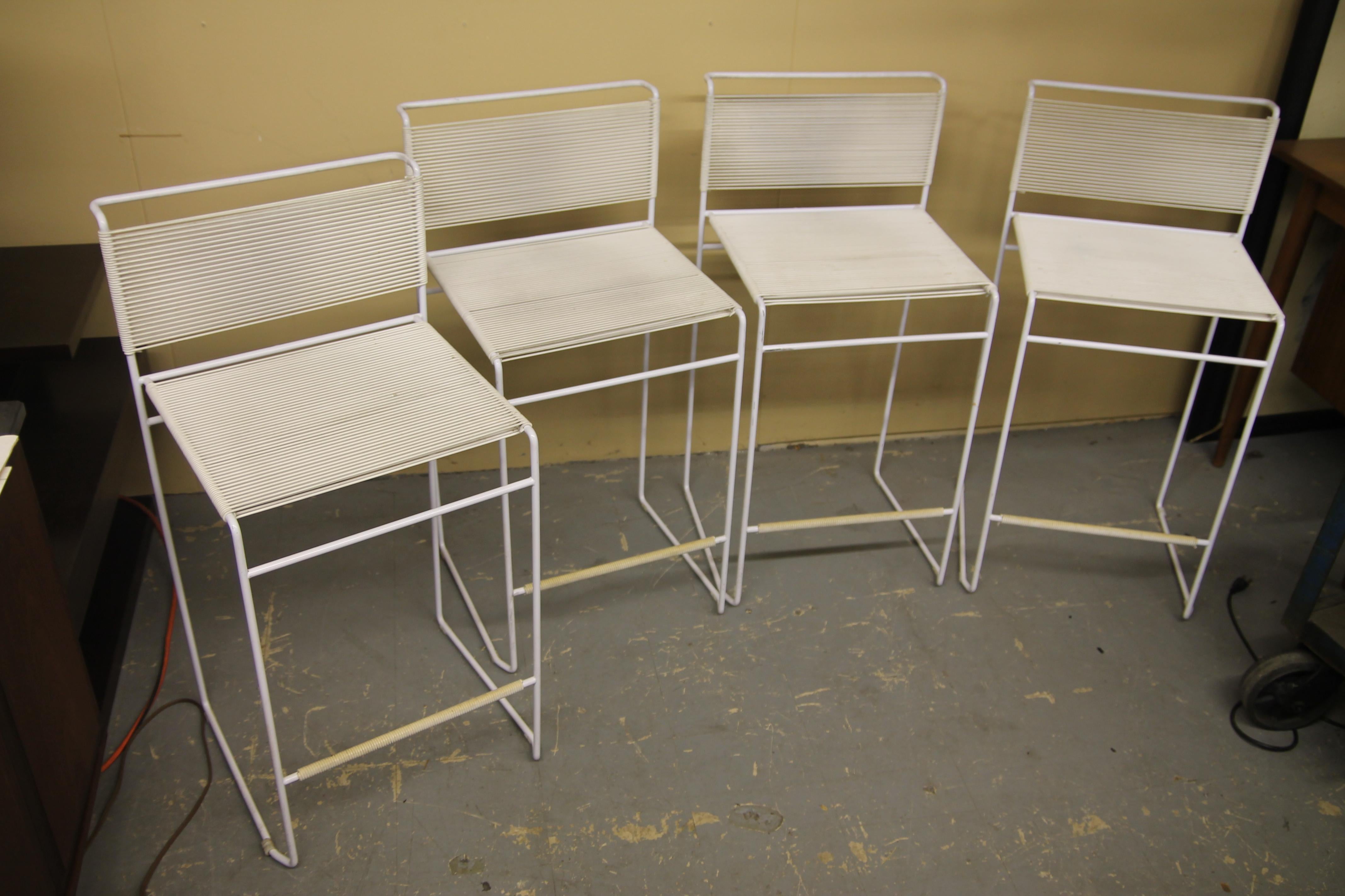 Set of 4 white fly line stools designed by Giandomenico Belotti. The stools are very comfortable and are stackable as well.