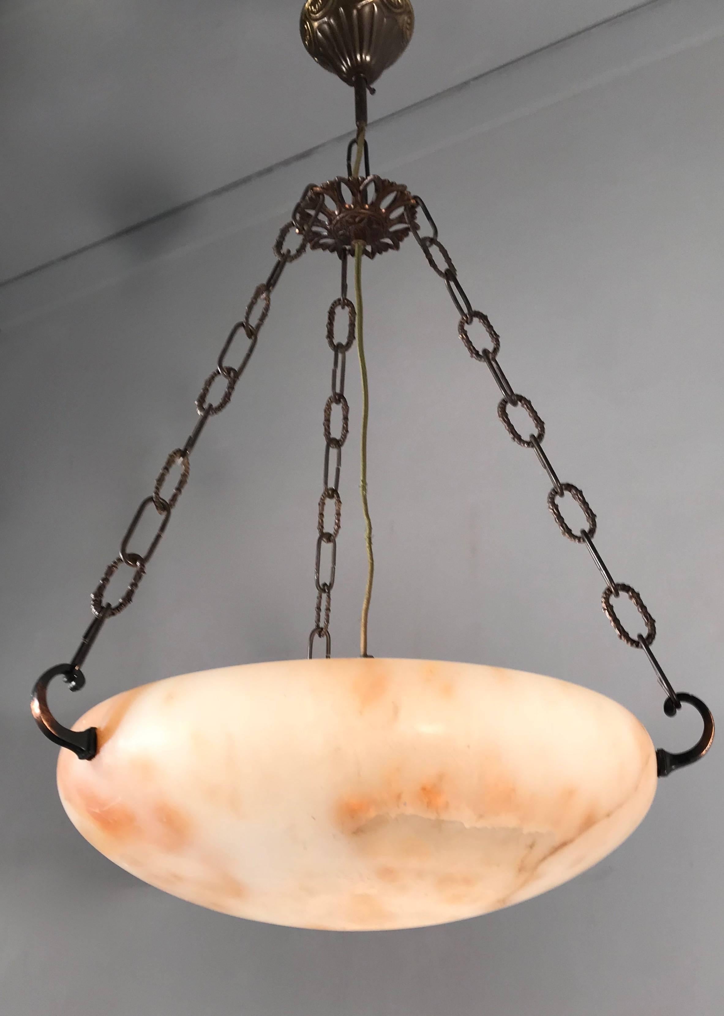 The ideal pendant for a hallway, bedroom, kitchen, restroom etc. 

This handcrafted, mid-size alabaster pendant is beautiful both in shape and condition. However, what makes this piece really stand out, is the way it looks when the light is switched