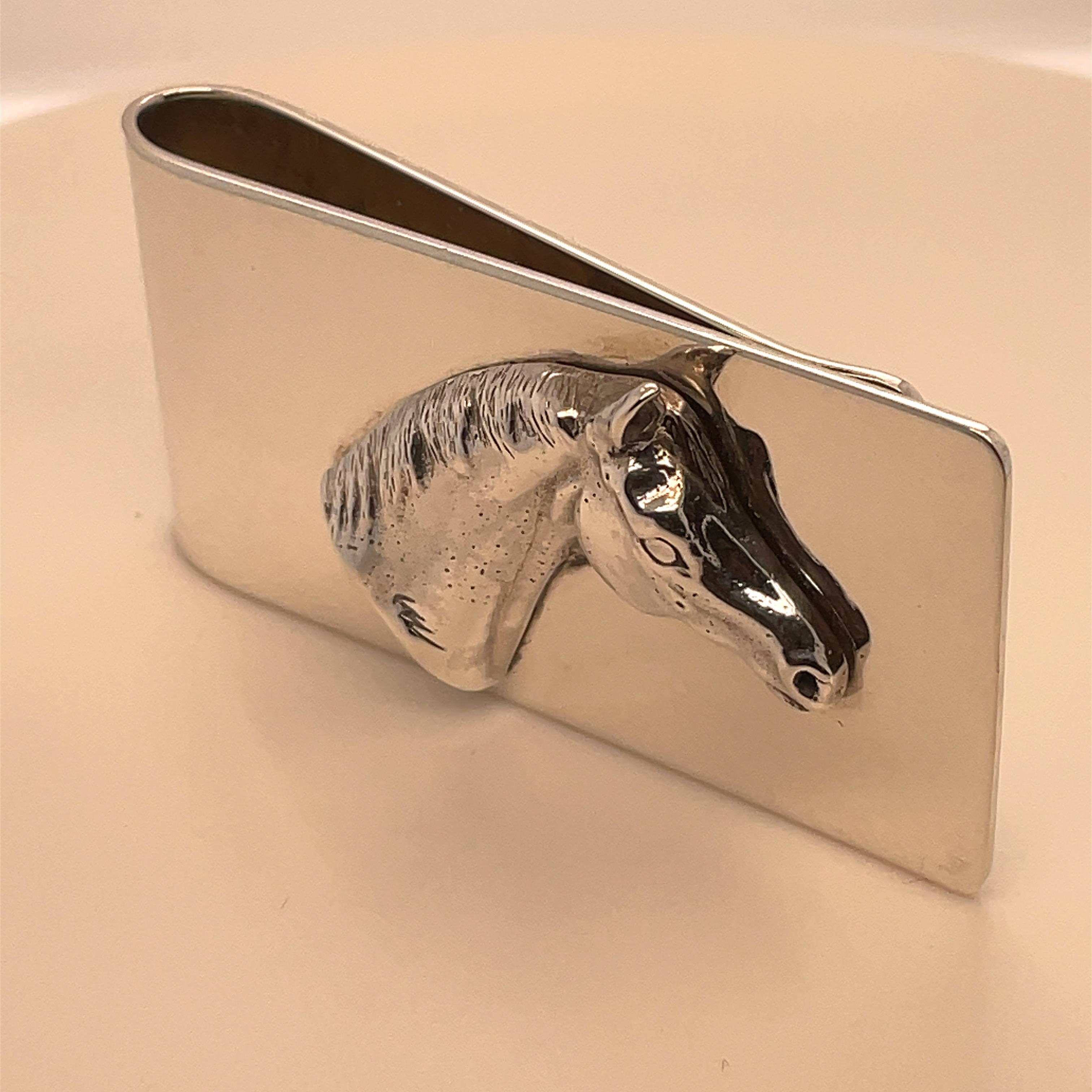 Outstanding sterling silver money clip.  Applied three-dimensional horse head in the center.  Super heavy gauge silver.  This is most substantial and impressive.
1 1/8
