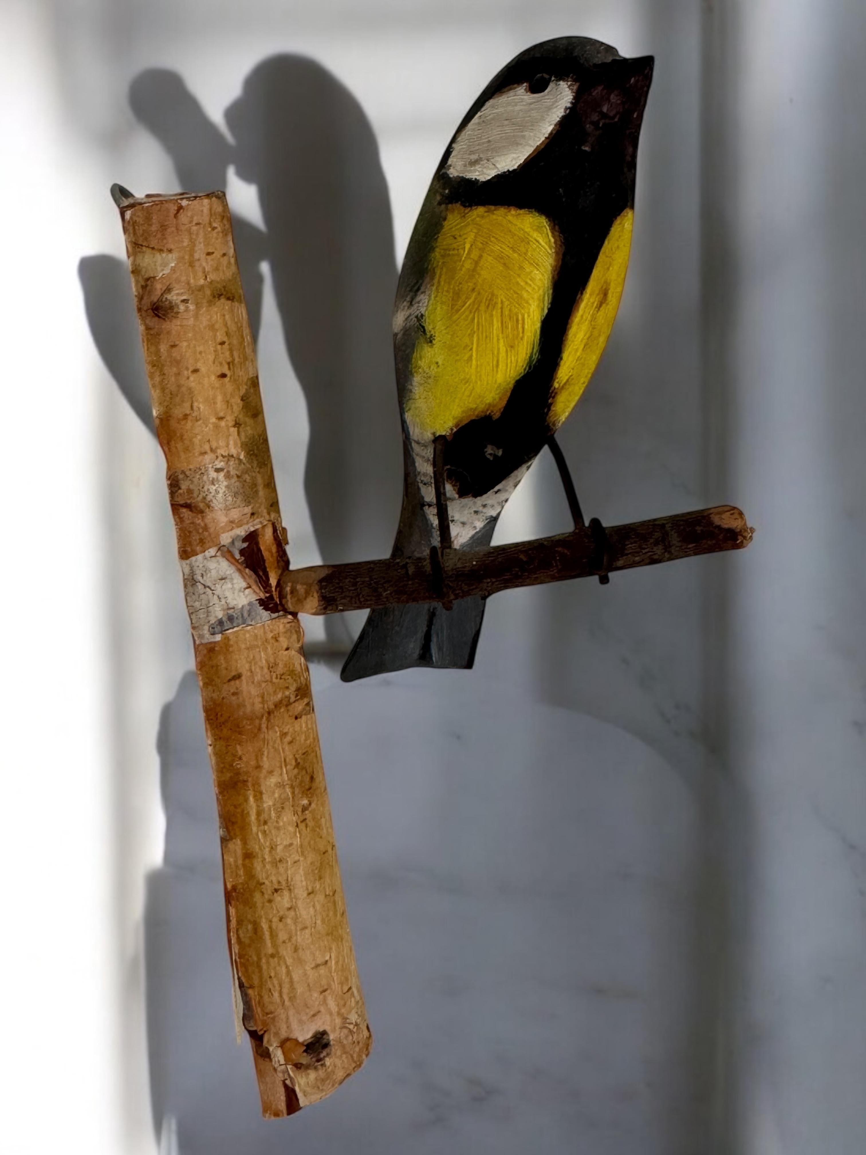 A beautiful Austrian 20th century, carved wood bird, mounted on a stand for hanging. The tradition of these in Austria called 
