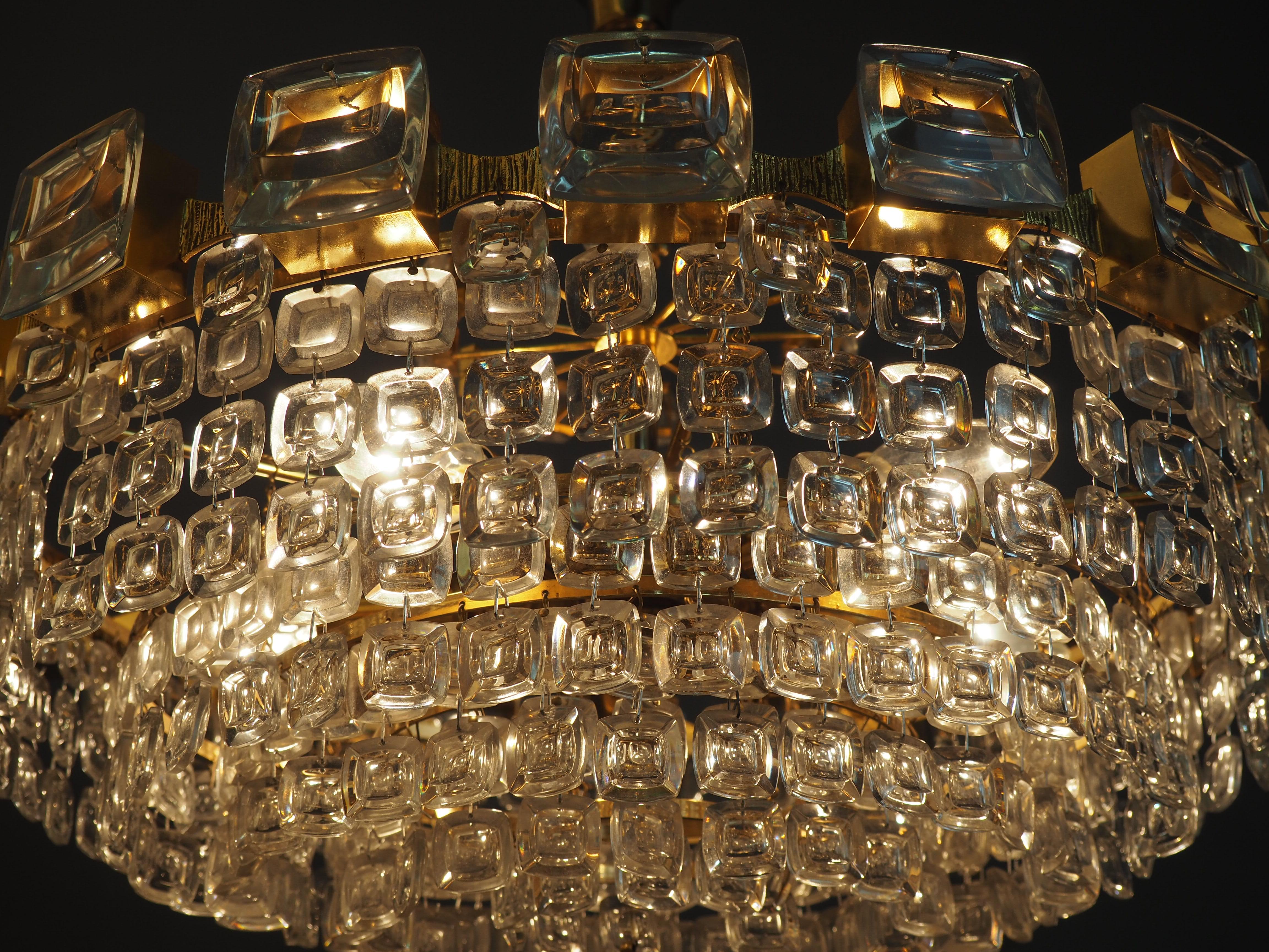 German Great Six-Tiered Gilt Brass and Lens Glass Chandelier by Palwa, circa 1970s For Sale