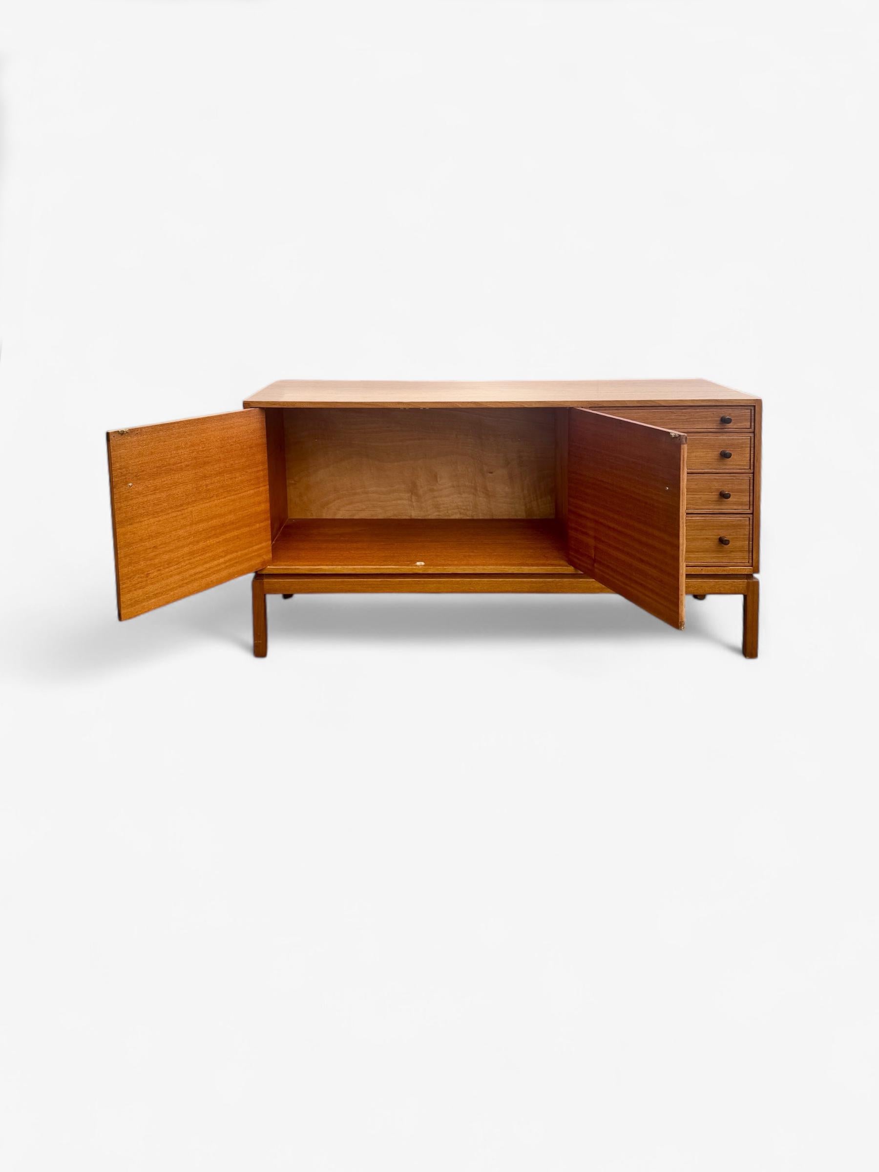 This elegant Greaves & Thomas sideboard exemplifies all that is the best of midcentury british modern design, with an understated elegance and simplicity and cleanliness of minimalist lines.