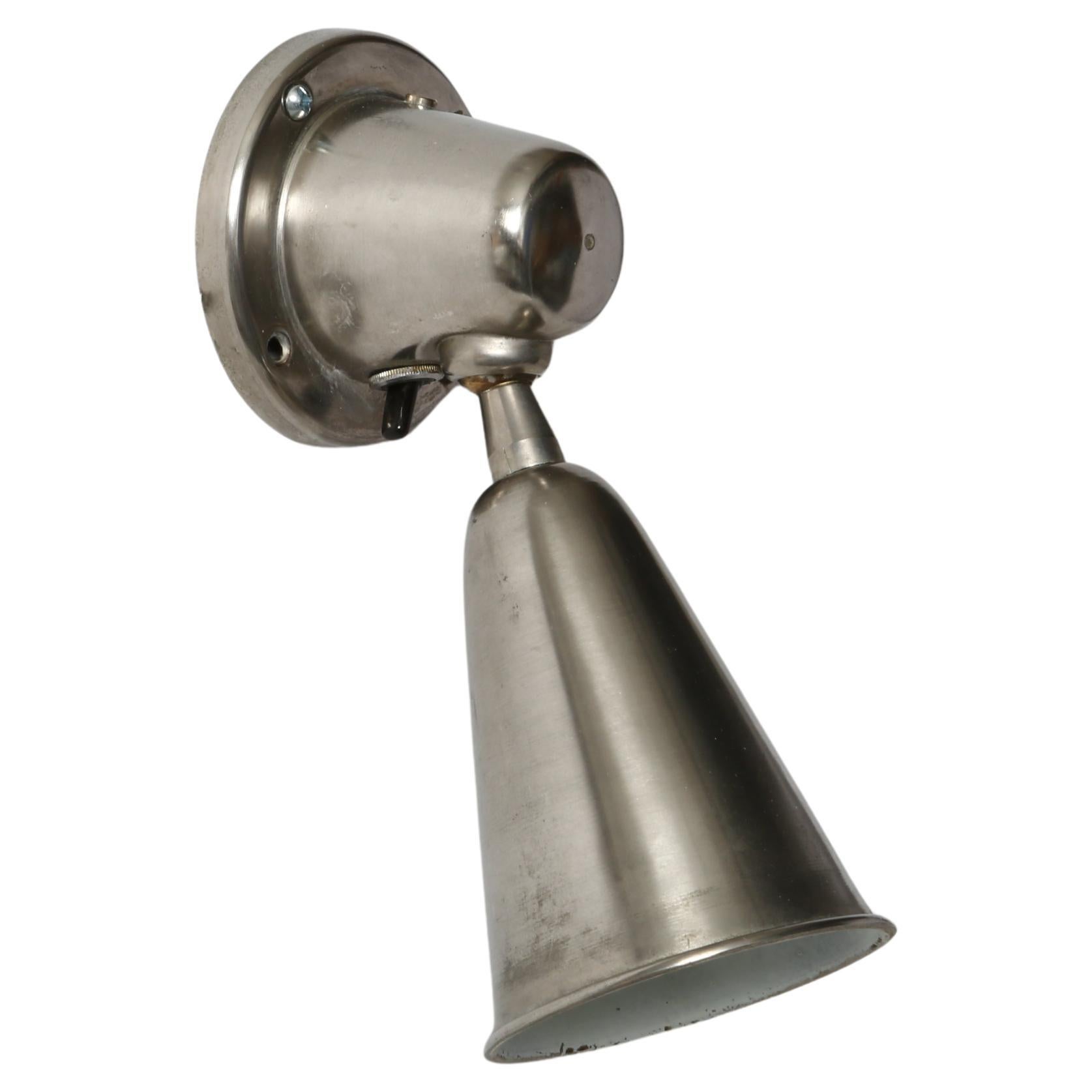 Greco Illuminazione sconces or ceiling lights, a pair
Made in Italy, 1960s
Nickel plated brass, enameled on the inside.
Sconces pivot in different directions.
Takes one candelabra bulb each.
Complimentary US rewiring with a custom backplate upon