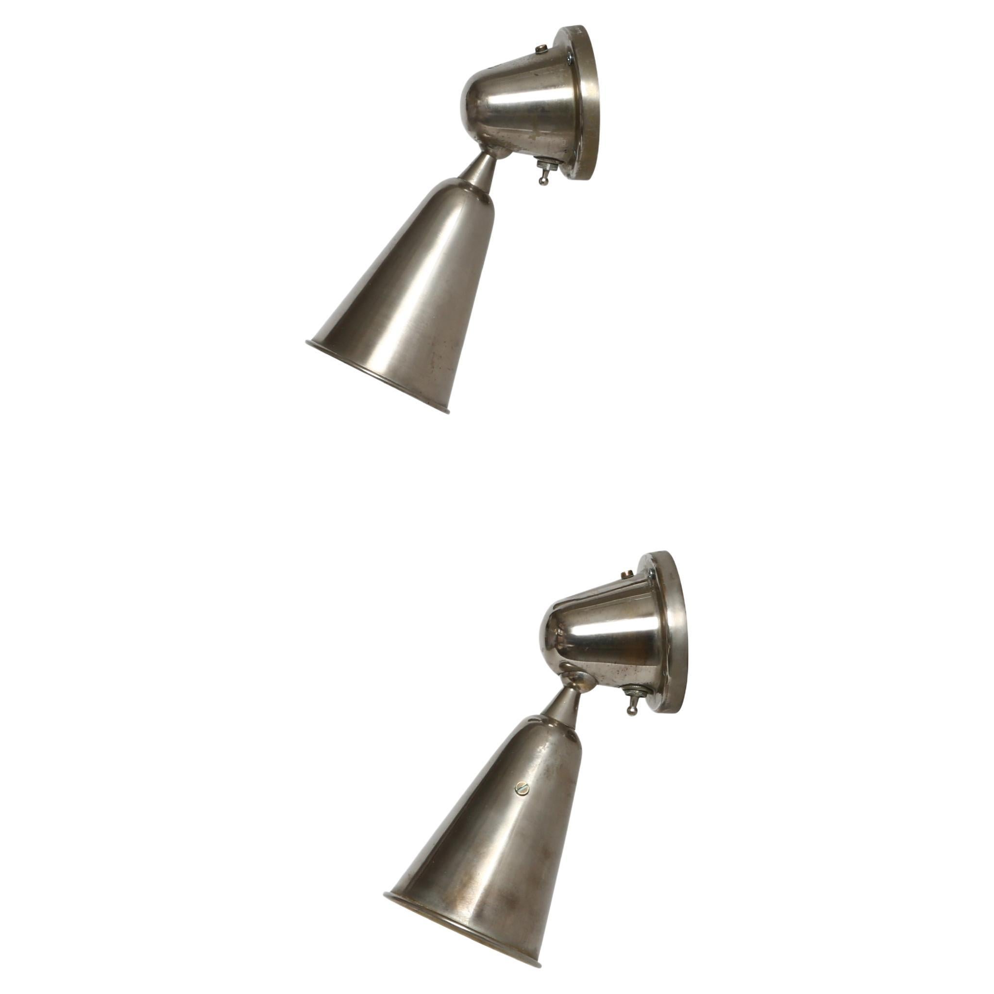 Greco Illuminazione sconces or ceiling lights.
Made in Italy, 1960s
Nickel plated brass, enameled on the inside.
Sconces pivot in different directions.
Take one candelabra bulb each.
Complimentary US rewiring with a custom backplate upon