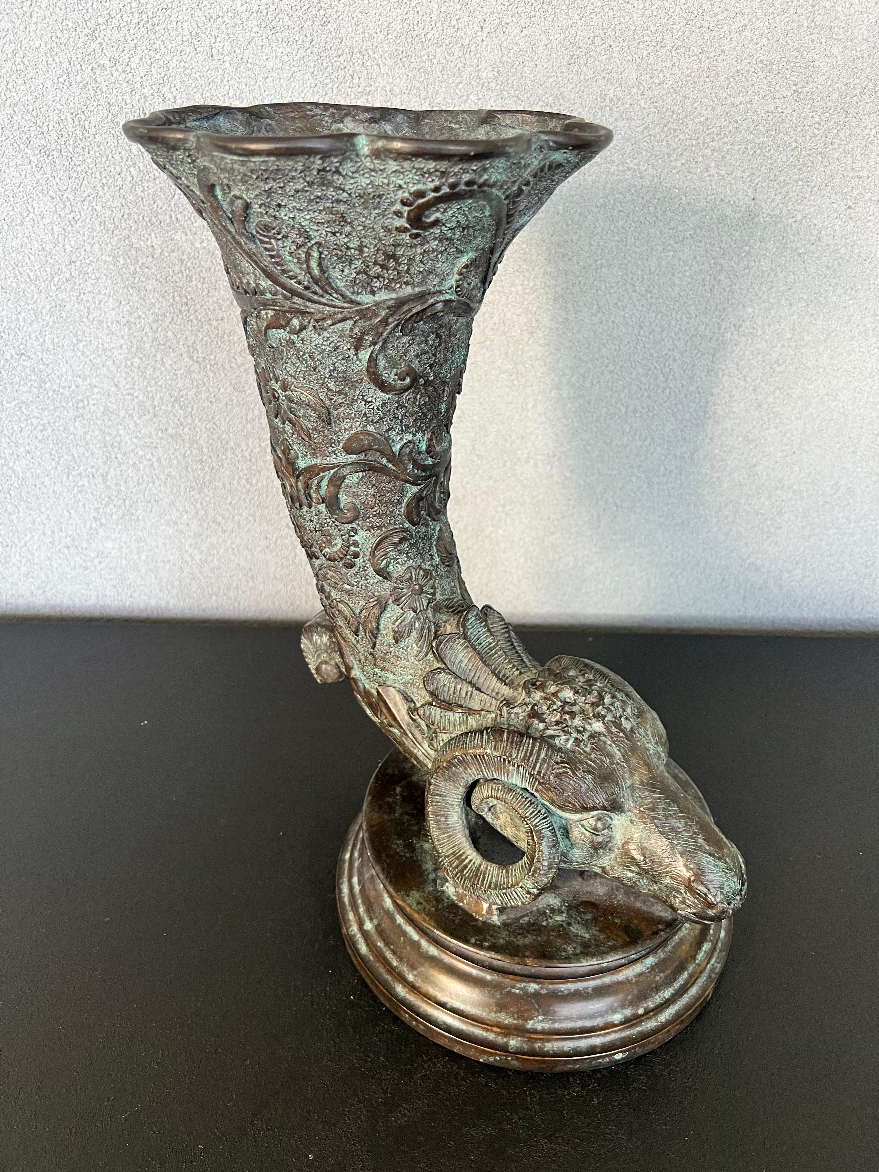 An excellent handmade vase in the form of a ram with a generously scaled cornucopia - top fit for florals.
Beautiful detailed and heavy that would be a statement piece in any location of your home. 
Made by hand by Maitland Smith in Thailand