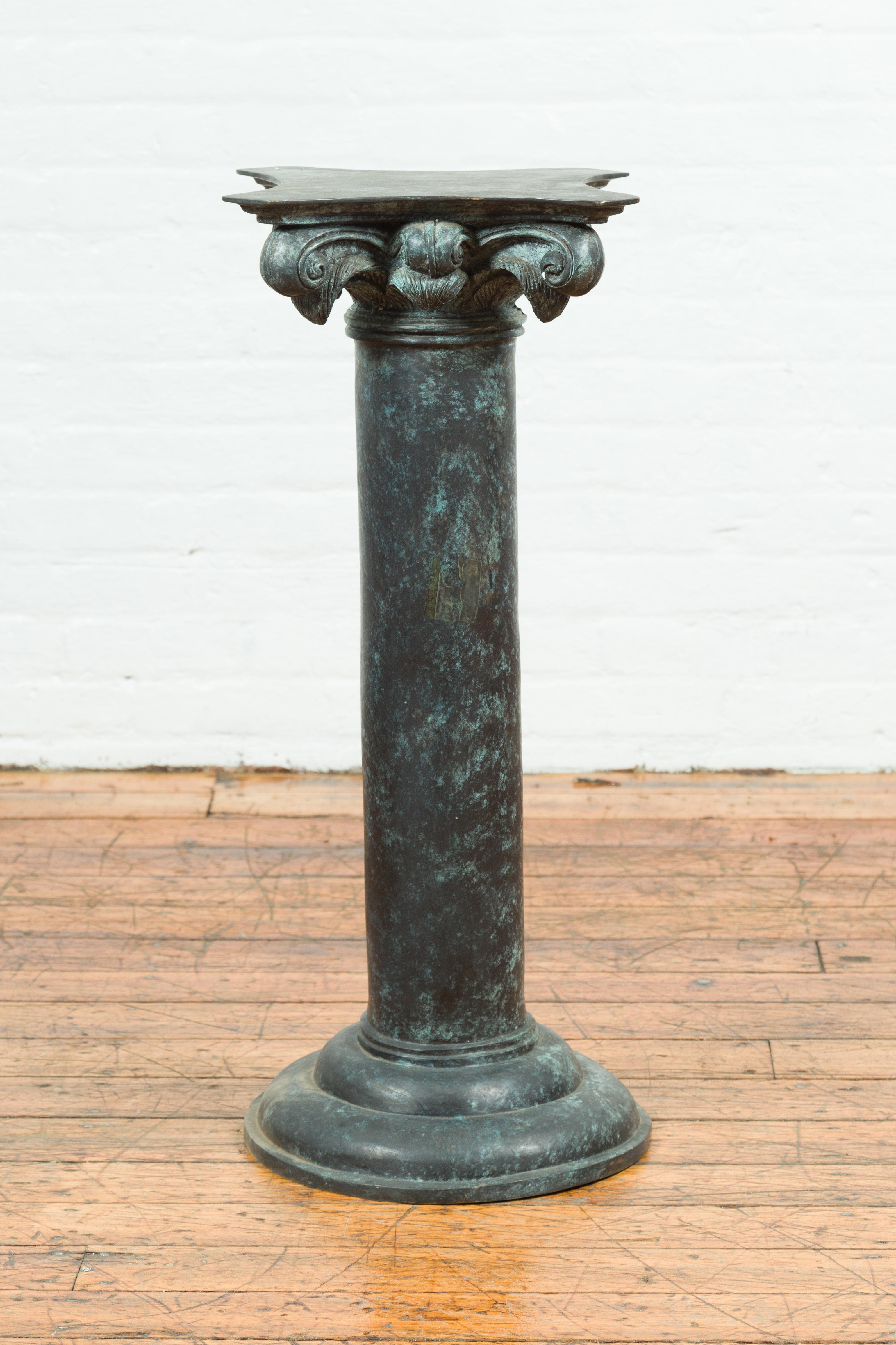 A vintage Greco Roman style bronze column pedestal base from the mid-20th century, with composite style capital. Cast with the traditional technique of the lost-wax (à la cire perdue) allowing great precision in the details, this bronze pedestal