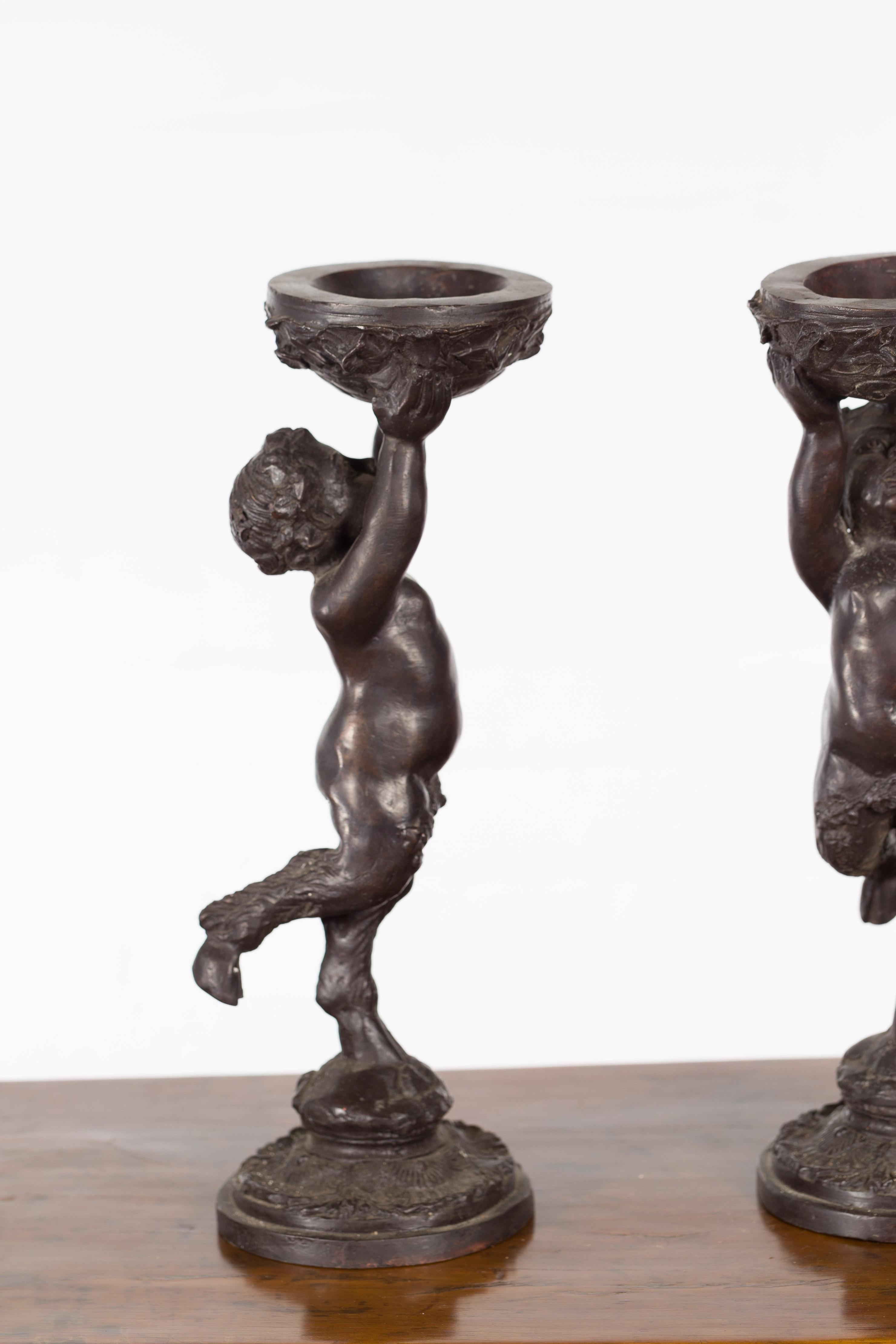 Greco-Roman Style Bronze Candle Holders Depicting Young Satyrs Holding Vessels For Sale 5