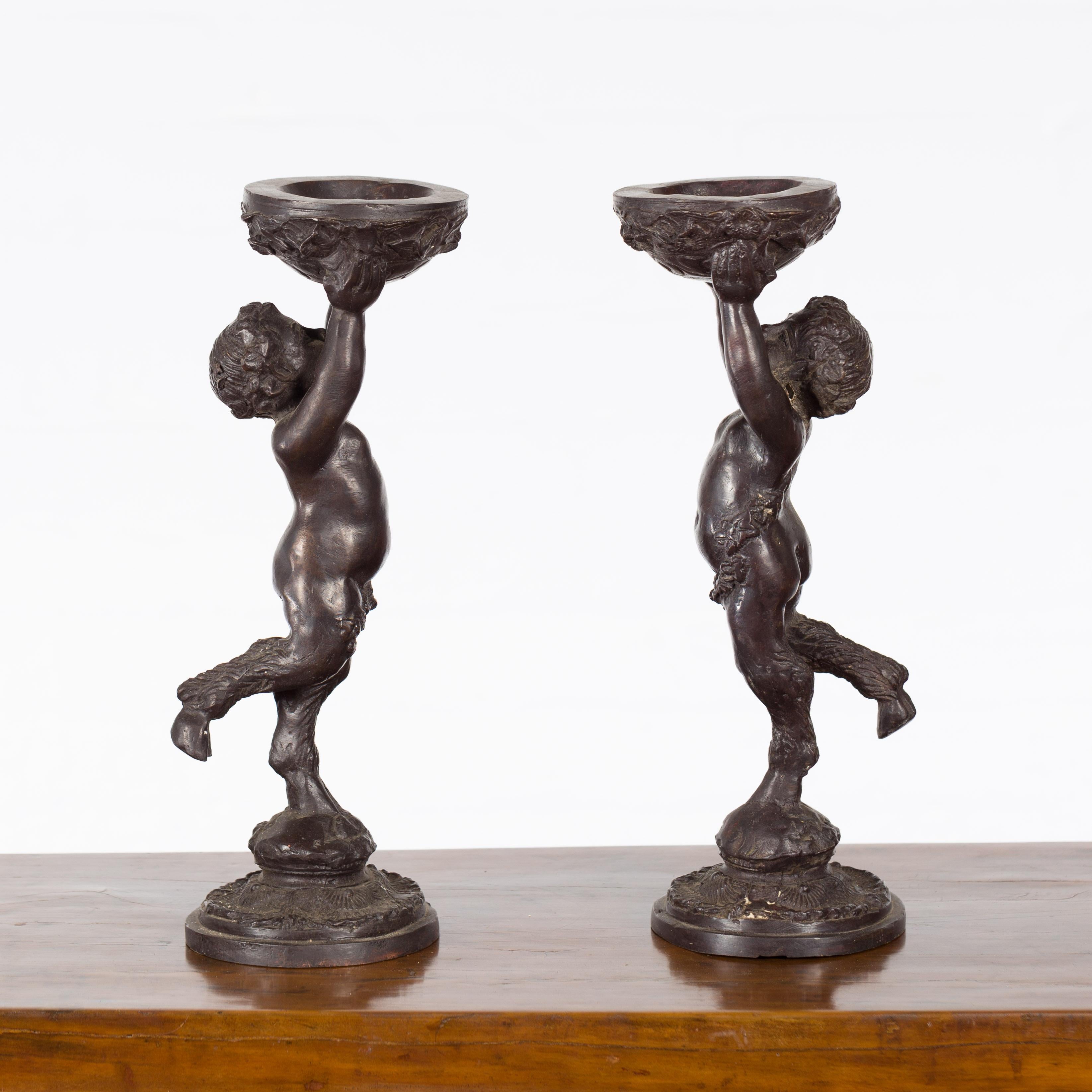 Greco-Roman Style Bronze Candle Holders Depicting Young Satyrs Holding Vessels For Sale 6