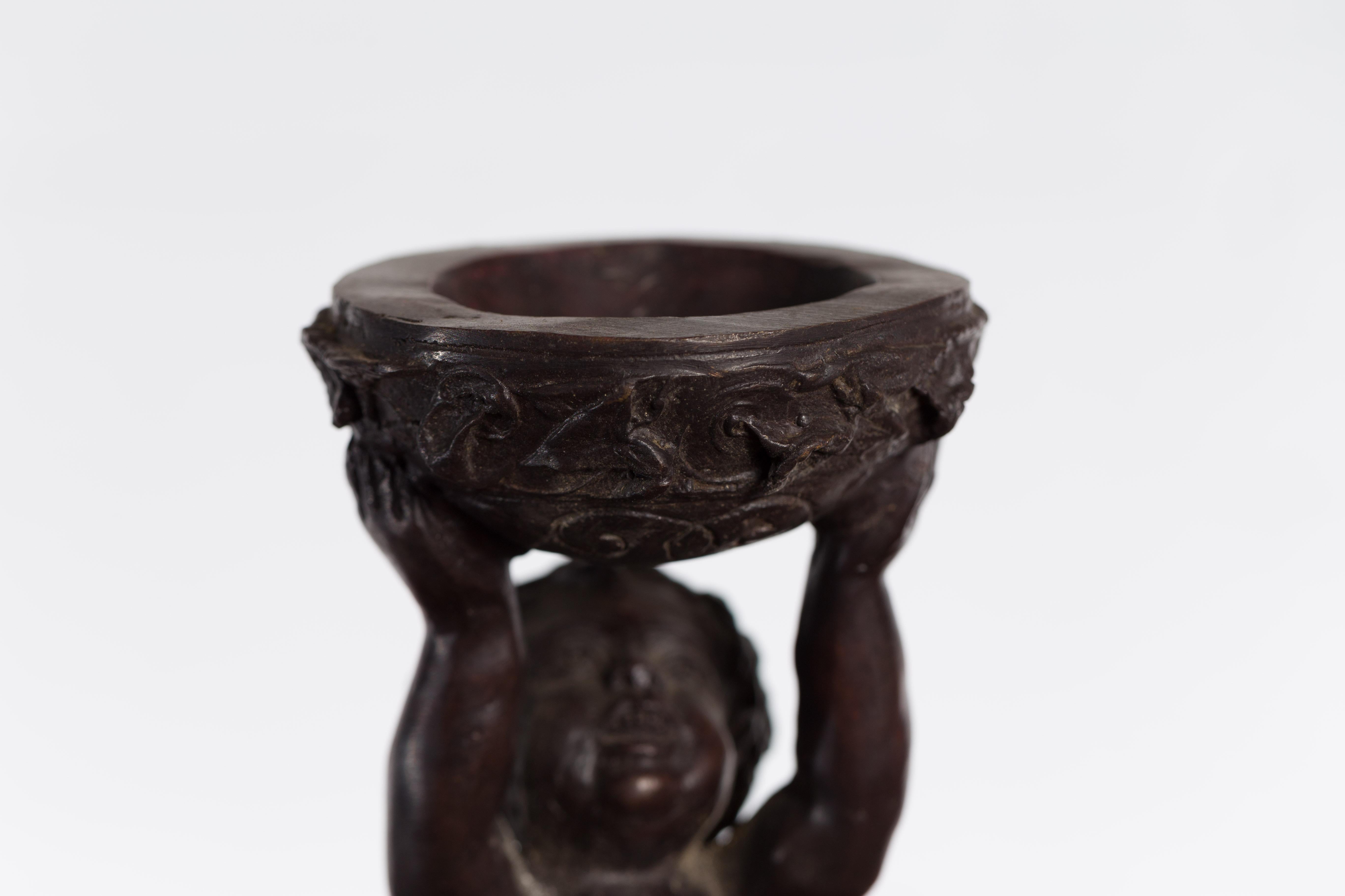 20th Century Greco-Roman Style Bronze Candle Holders Depicting Young Satyrs Holding Vessels For Sale