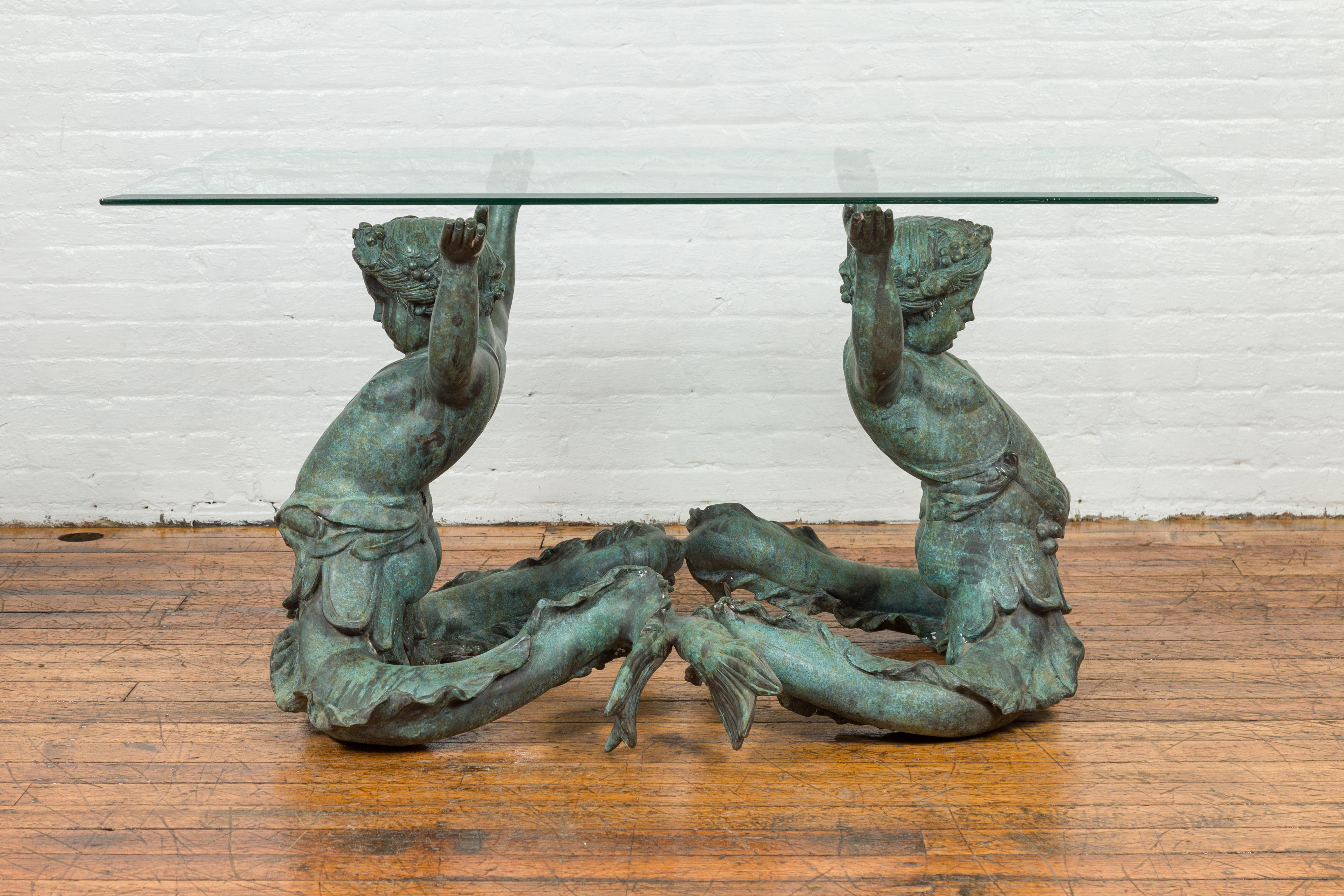 A Greco Roman style contemporary bronze double triton dining room table base, glass top not included. (The top is included to help evoke the possibilities). Created with the traditional technique of the lost-wax (à la cire perdue) that allows a
