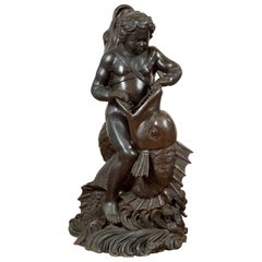 Fontaine en bronze vintage de style gréco-romain représentant un putto chevauchant un dauphin