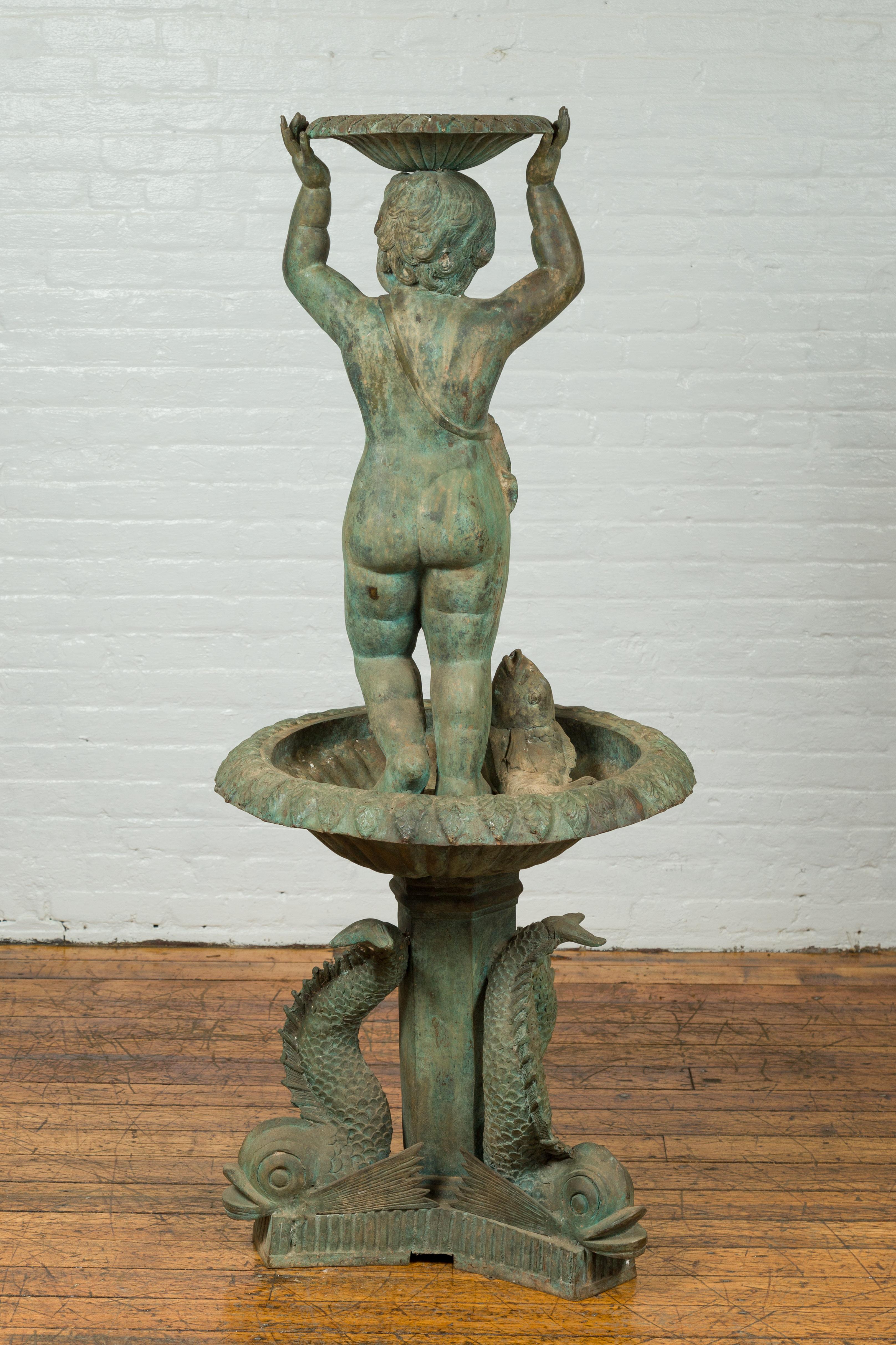 Greco Roman Style Vintage Putto and Fish Fountain with Distressed Verde Patina In Good Condition For Sale In Yonkers, NY