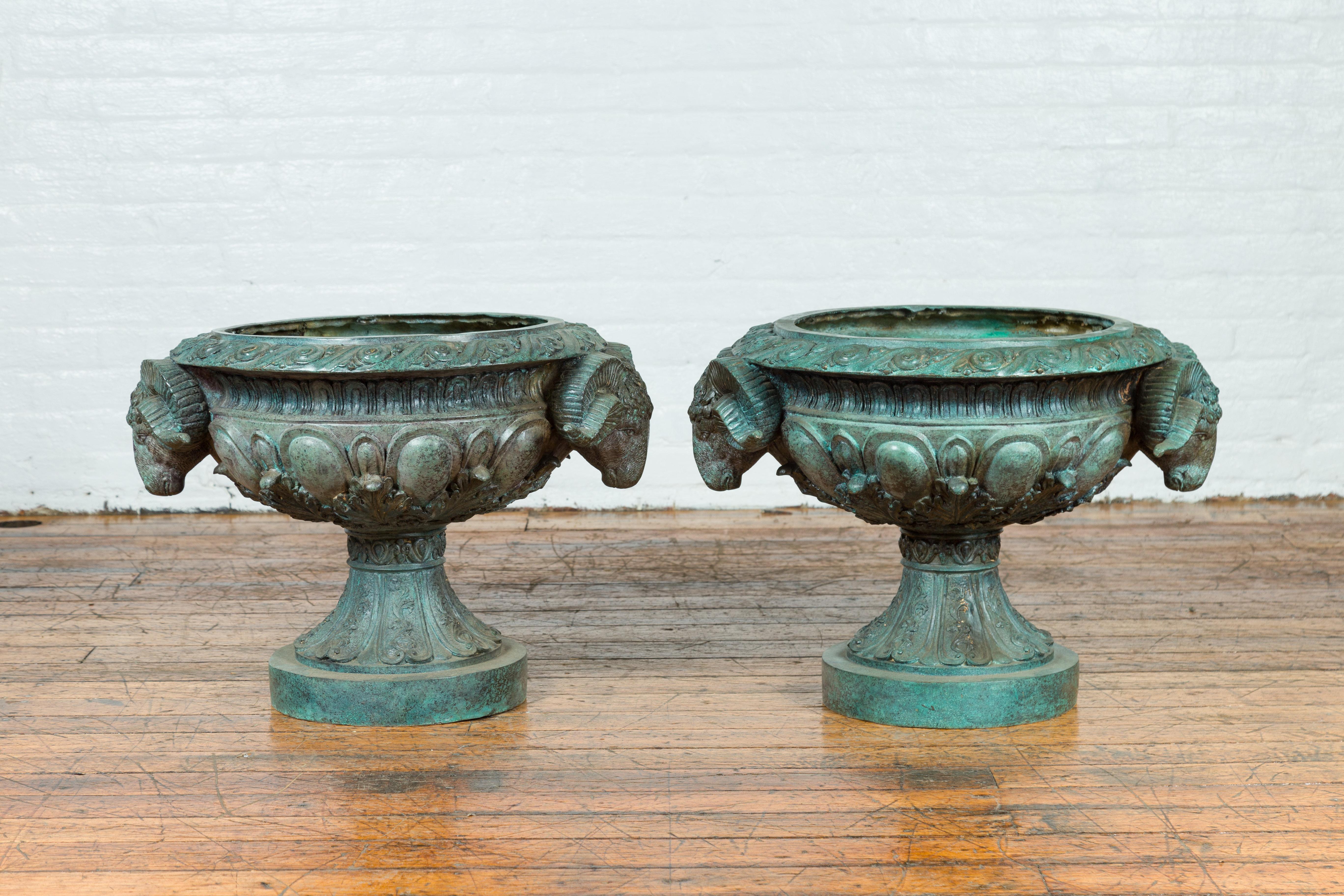 Two vintage Greco Roman style bronze urns from the late 20th century, with rams' heads and verde patina, priced and sold individually $2,800 each. Created with the traditional technique of the lost-wax (à la cire perdue) that allows a great