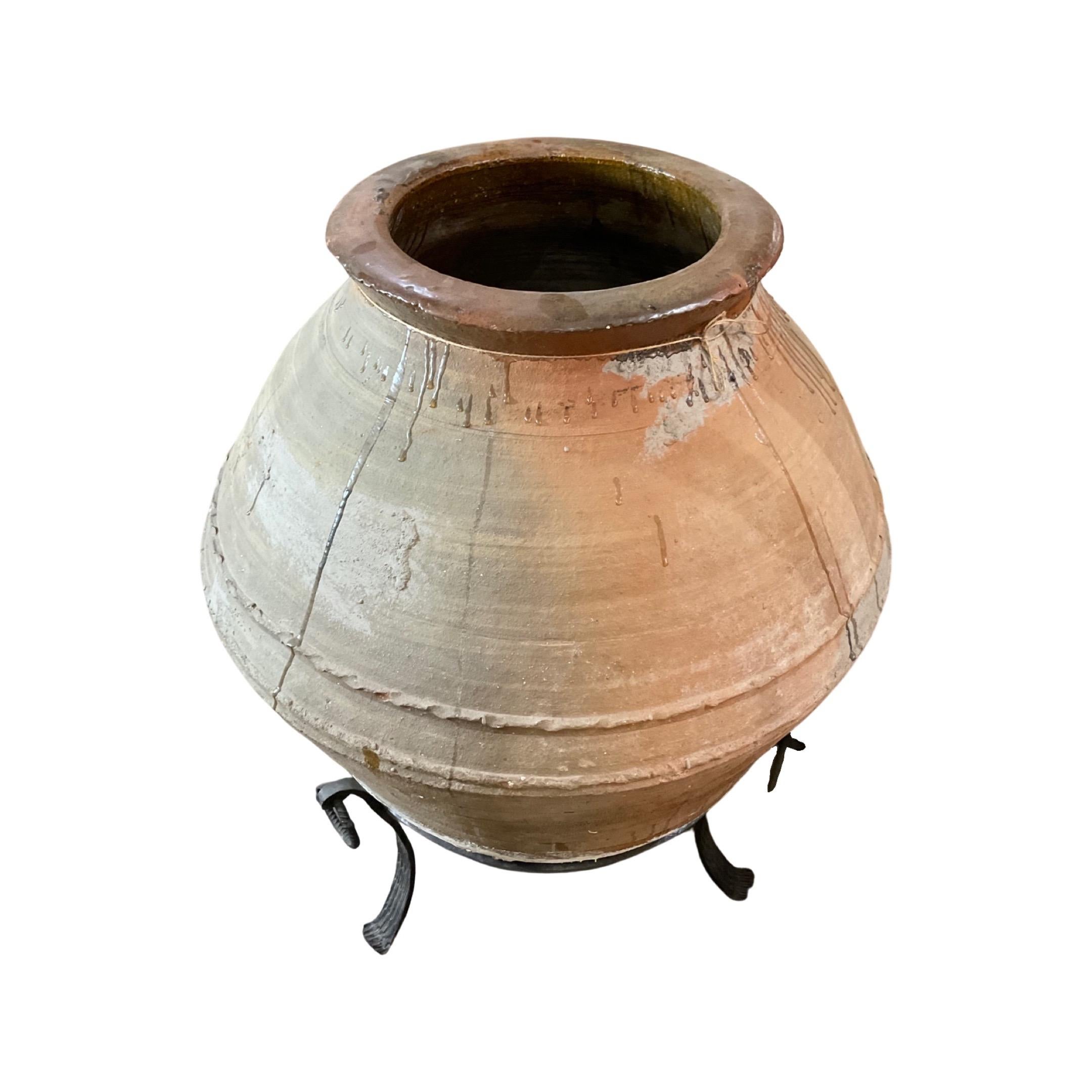 This traditional terracotta planter from Greece has been crafted from natural clay and fired at high temperatures, resulting in a durable, frost-resistant design that can withstand outdoor conditions for many years. Its 18th century origins make it