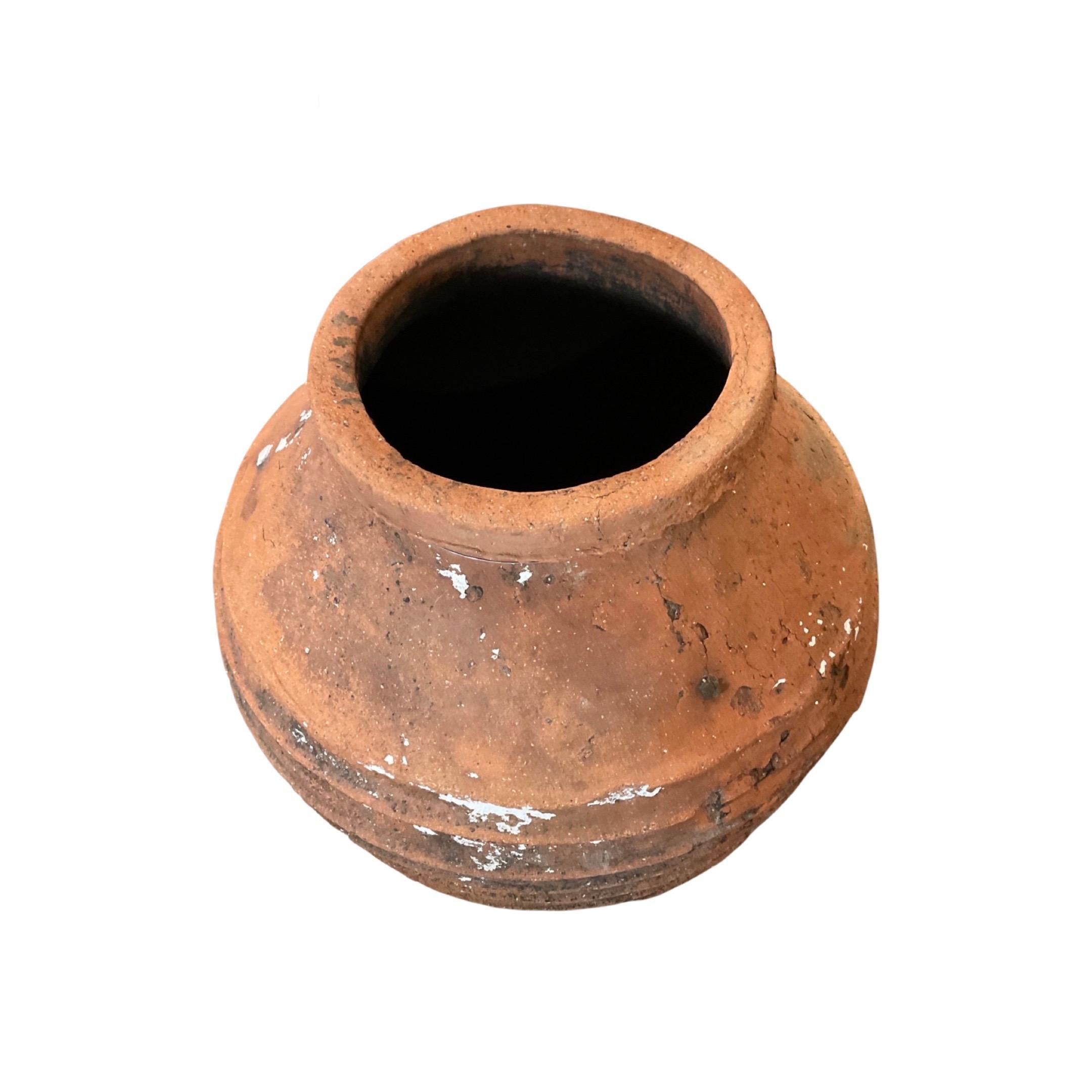 This traditional terracotta planter from Greece has been crafted from natural clay and fired at high temperatures, resulting in a durable, frost-resistant design that can withstand outdoor conditions for many years. Its 18th century origins make it