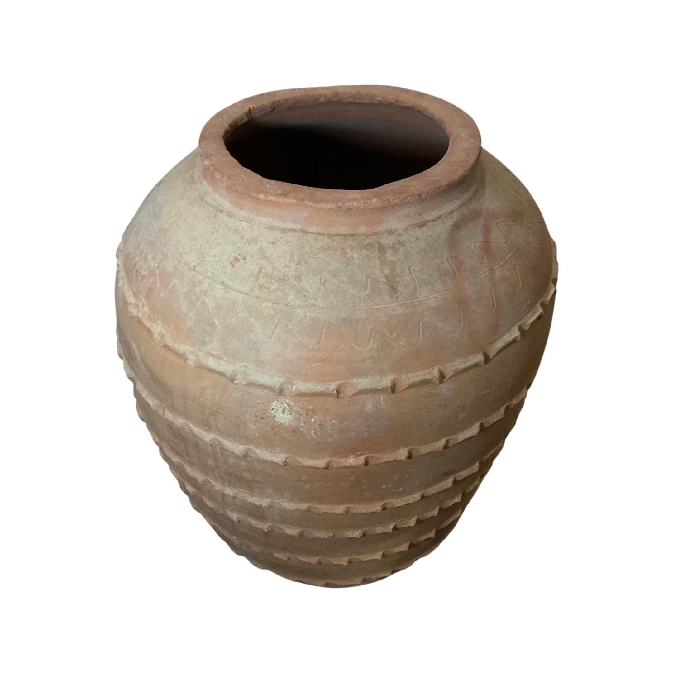 This timeless Greek terracotta planter is crafted from clay and fired in a kiln to form a durable, frost-proof build that can endure outdoor conditions indefinitely. Of 18th century provenance, it furnishes a classic look and distinctive charm.