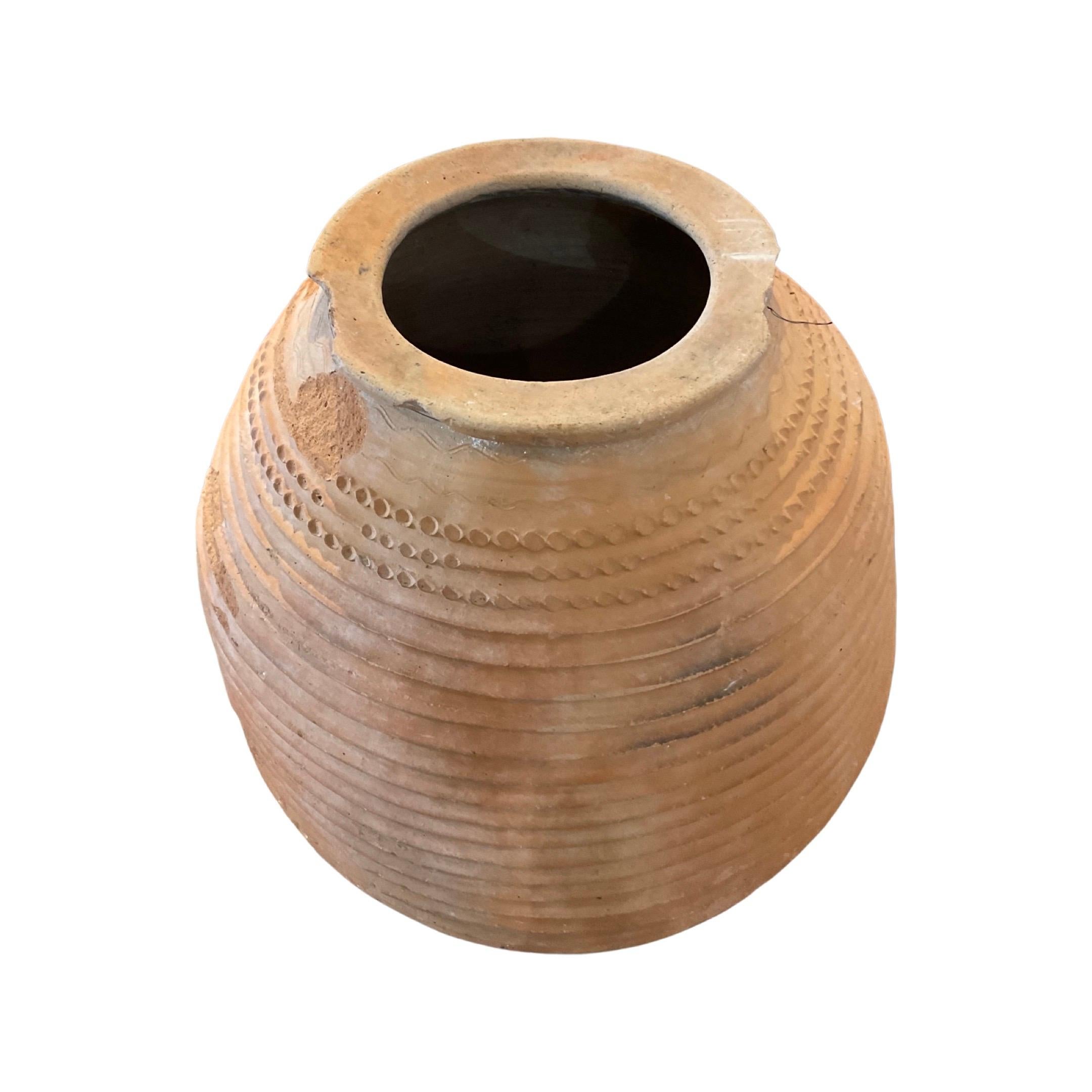 This timeless Greek terracotta planter has been crafted from clay and fired in a kiln to form a Frost-proof, durable construction capable of withstanding outdoor conditions for an indefinite period of time. Dating back to the 18th century, its