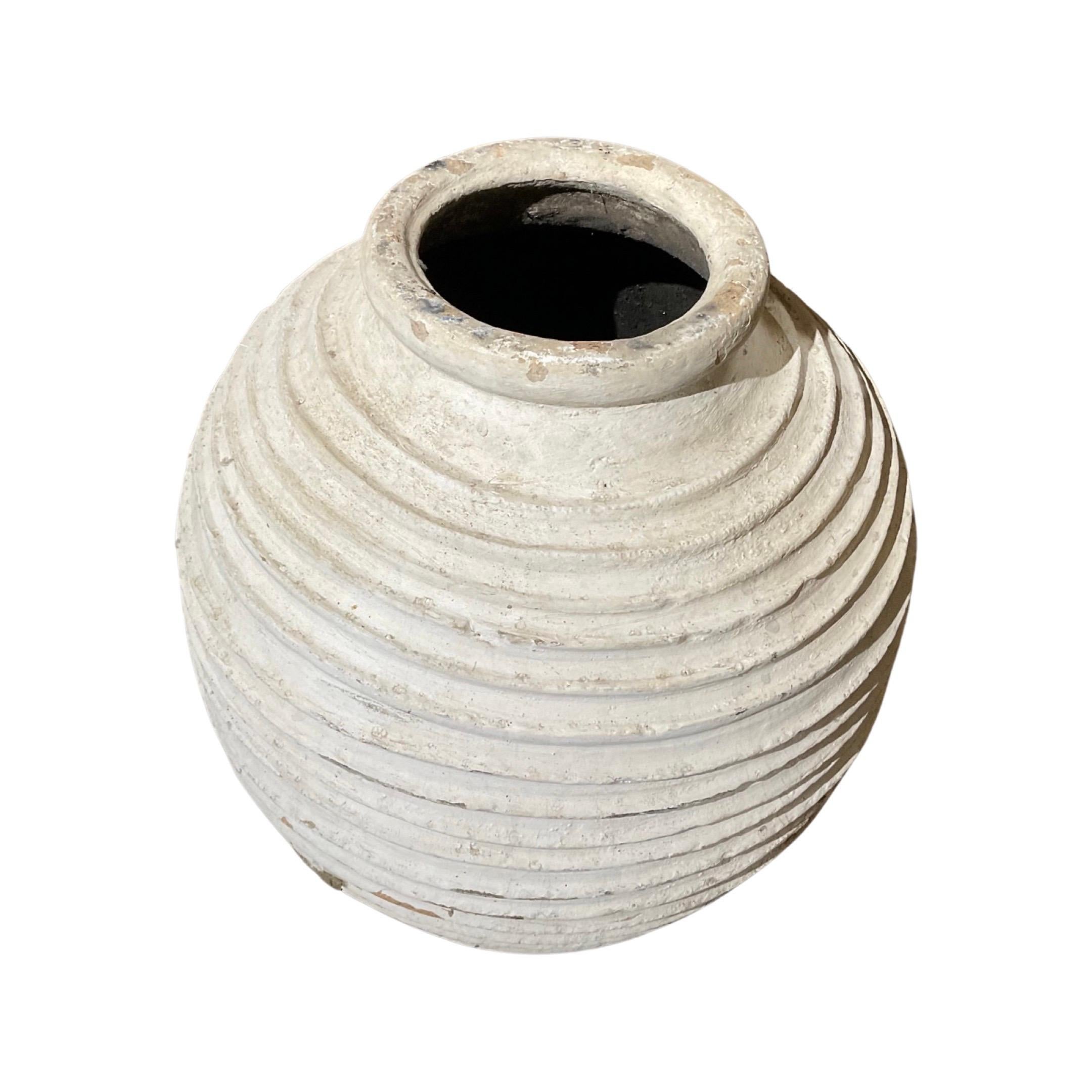 This 18th century terracotta planter is a perfect addition to any garden or home, combining classic craftsmanship with modern style. Crafted in Greece, it offers an authentic aesthetic with its white wash paint finish. Artistically crafted with