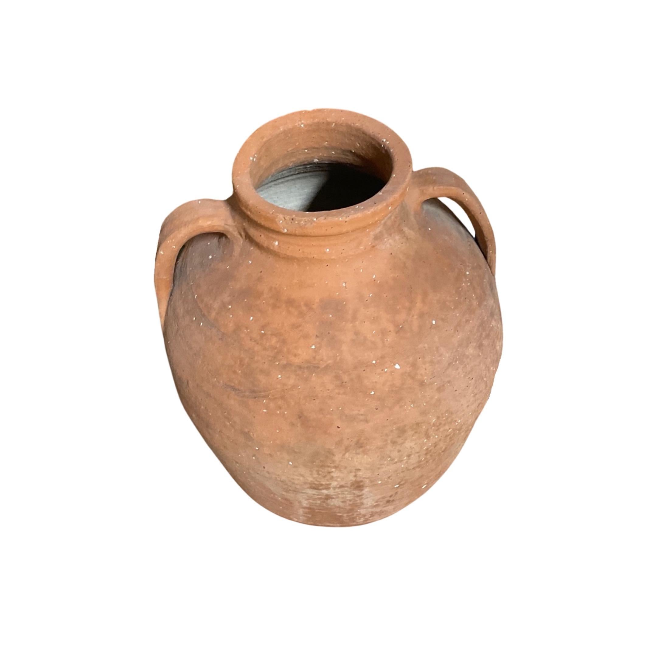 This unique Greek terracotta water vessel from the 18th century is perfect for adding a rustic and authentic decoration to your garden. It can be used for both functional and decorative purposes -as a water vessel, planter, or simply as ornamental