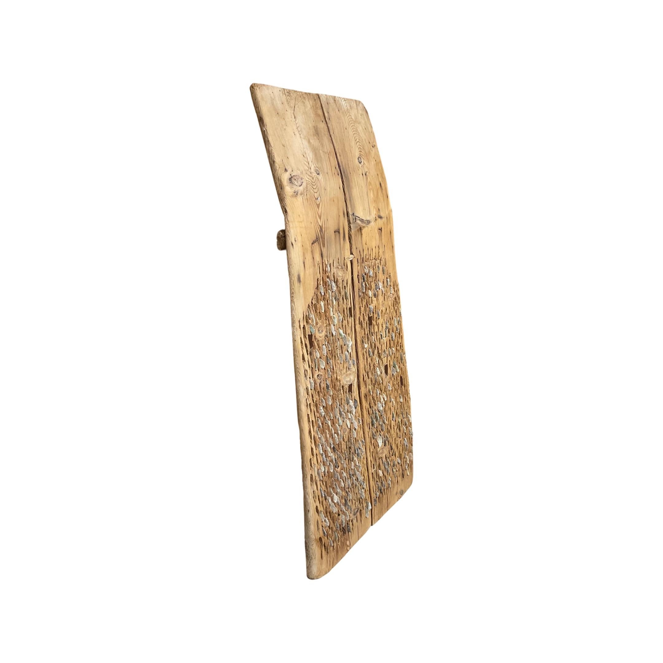 This unique Greece Wooden and Flint Stone Thresher is an authentic piece of 18th century furniture. Handcrafted in Greece, it's composed of natural wood and flint stones. Perfect for threshing, sorting, and cleaning wheat, it's perfect for any